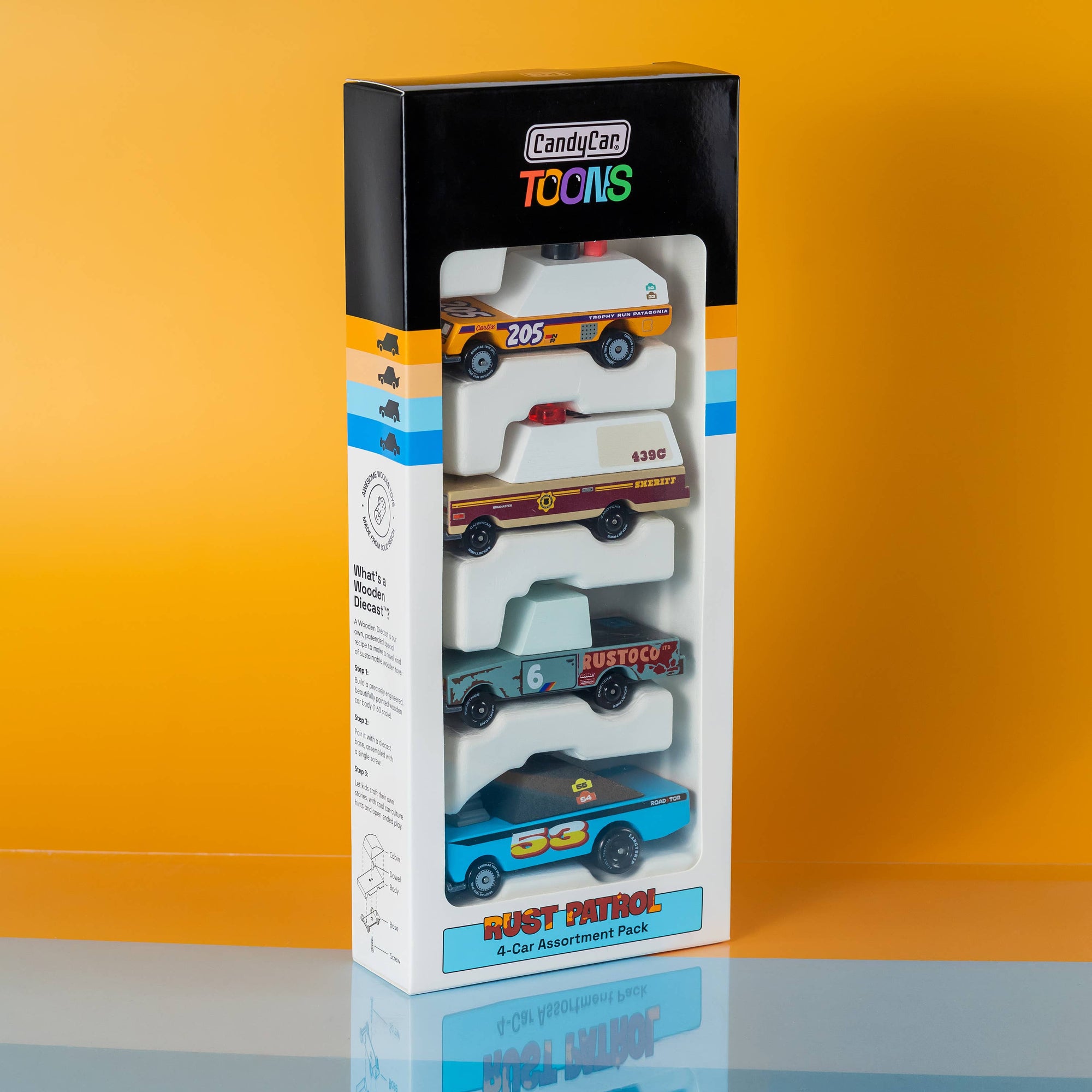 Box of toy cars with a colorful design on an orange background