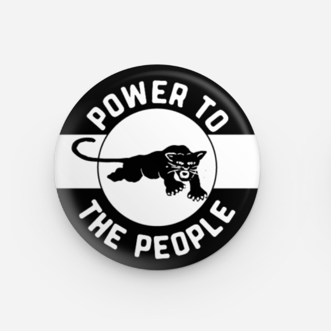Button badge with 'Power to the People' text and panther graphic on a white background