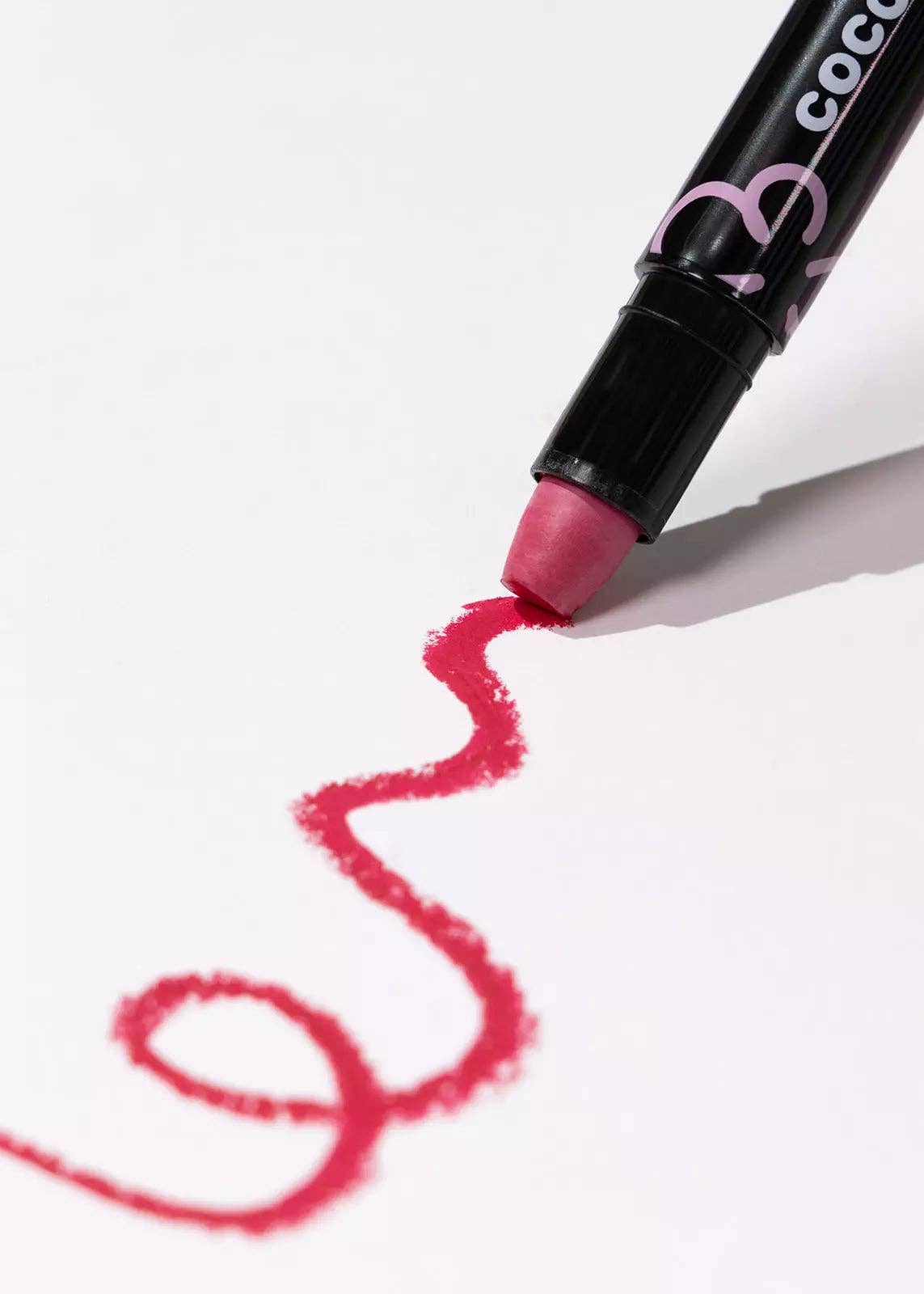 Pink crayon with 'Coco' branding on a white background
