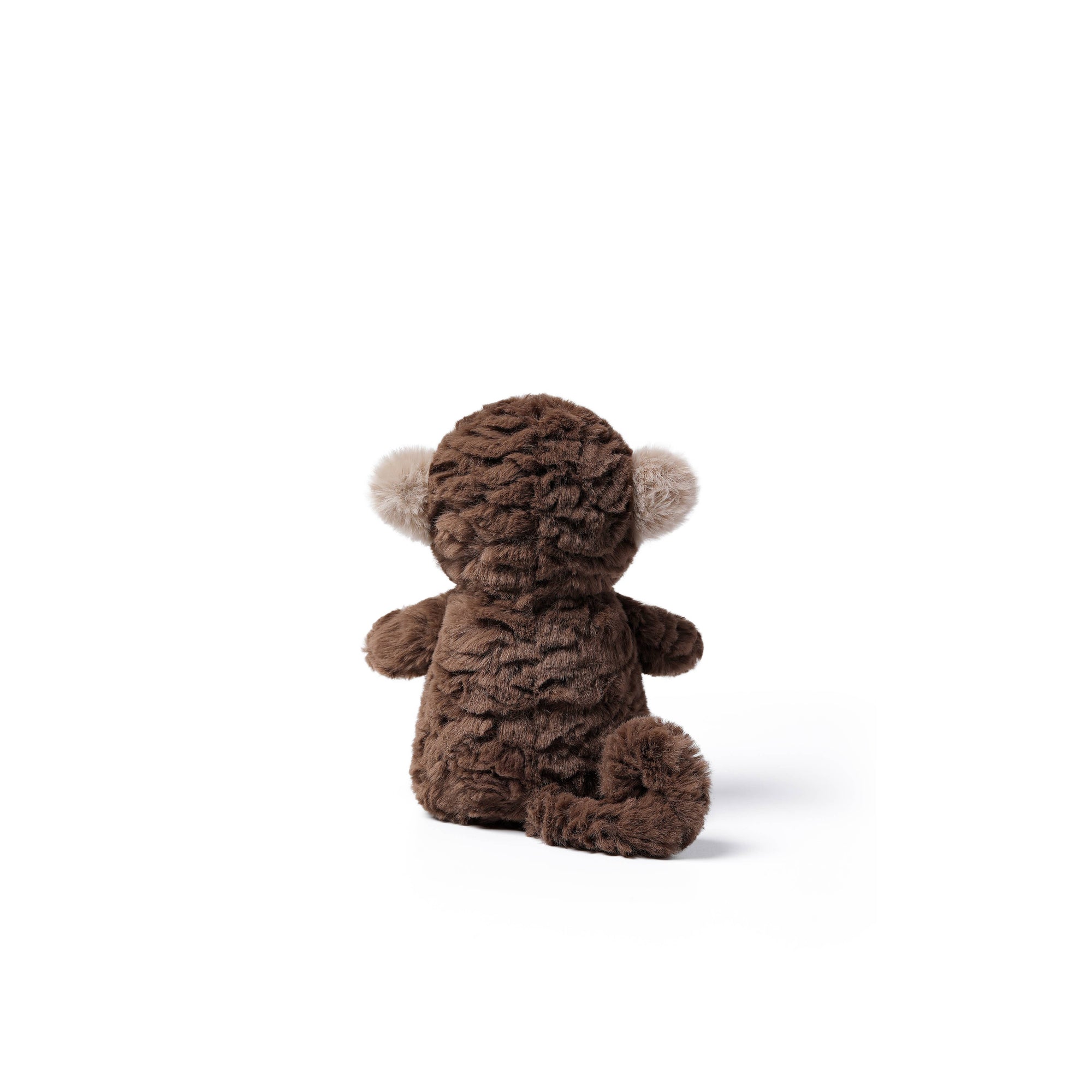 A small brown plush monkey toy viewed from the back, featuring a textured, curly brown body and light beige pom-pom ears, set against a plain white background.