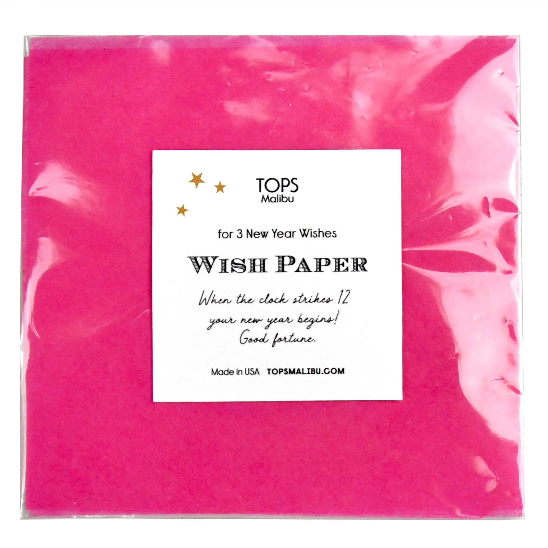 Pink wish paper with a label on a white background