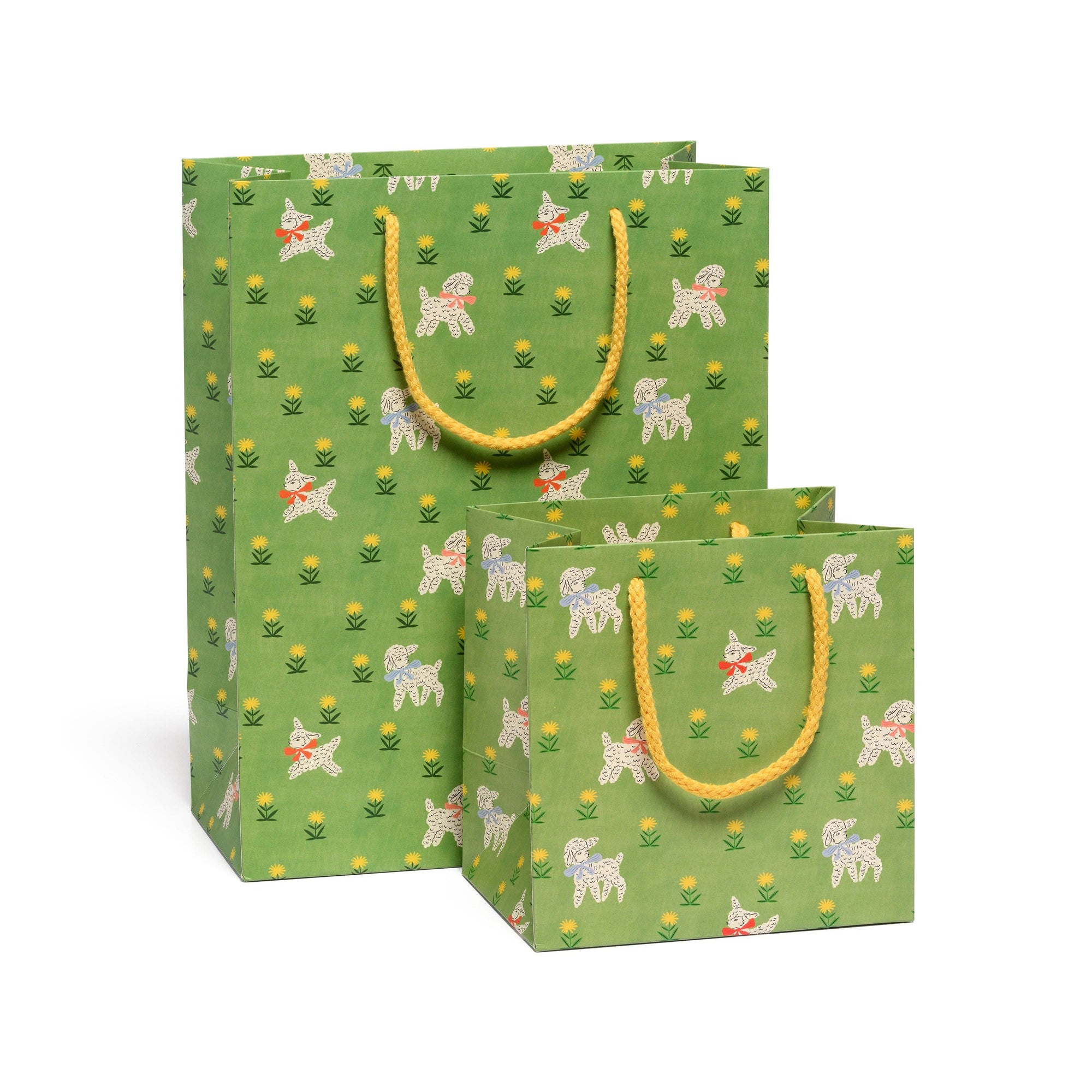 Two green gift bags with dog pattern and yellow handles on a white background