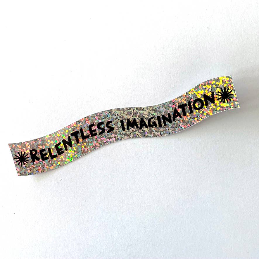 Decorative headband with 'Relentless Imagination' text on a white background