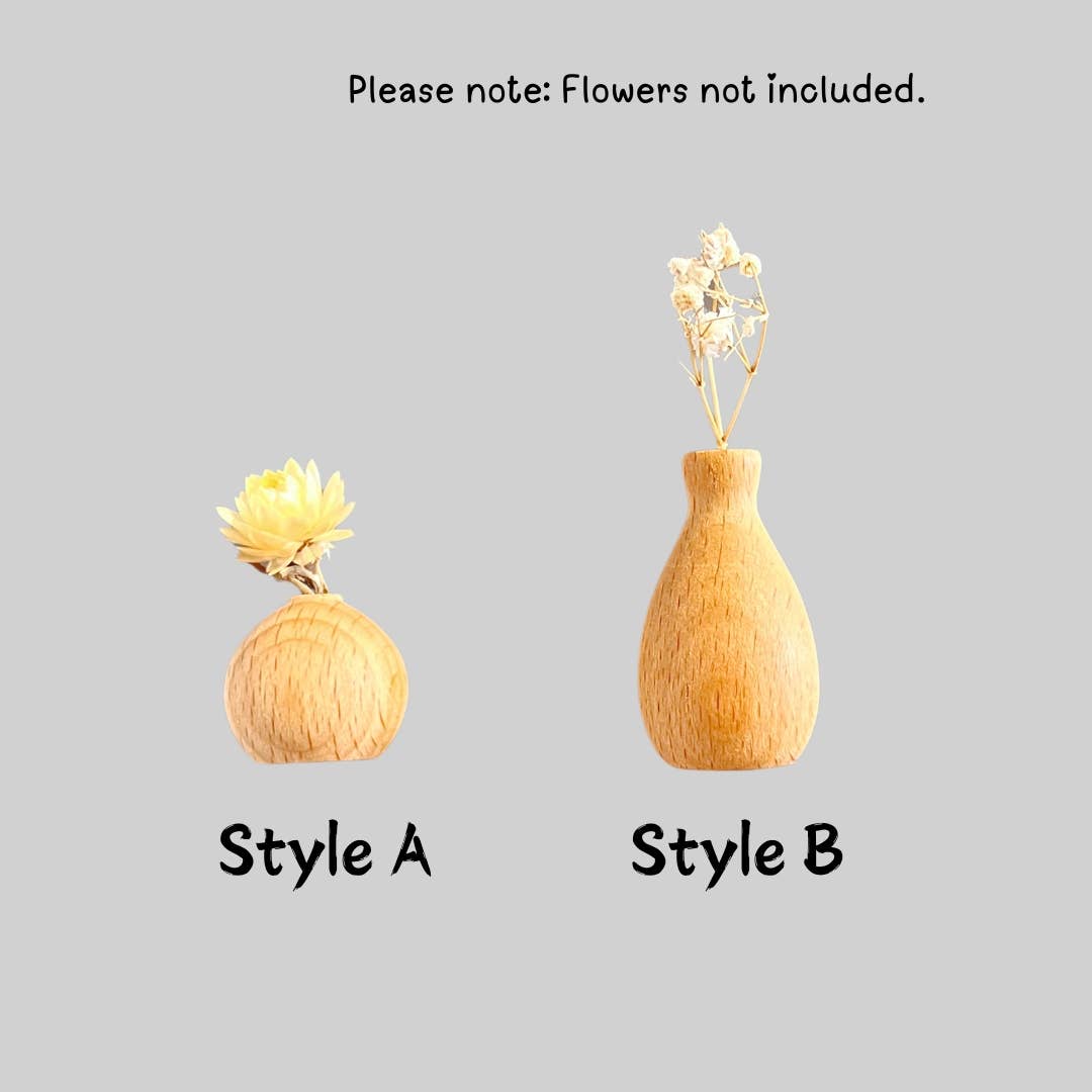 Two wooden vase-style diffusers or holders shown on a plain light gray background, labeled Style A and Style B, with a note at the top saying flowers are not included.