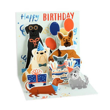 Birthday card with cartoon dogs and balloons on a white background