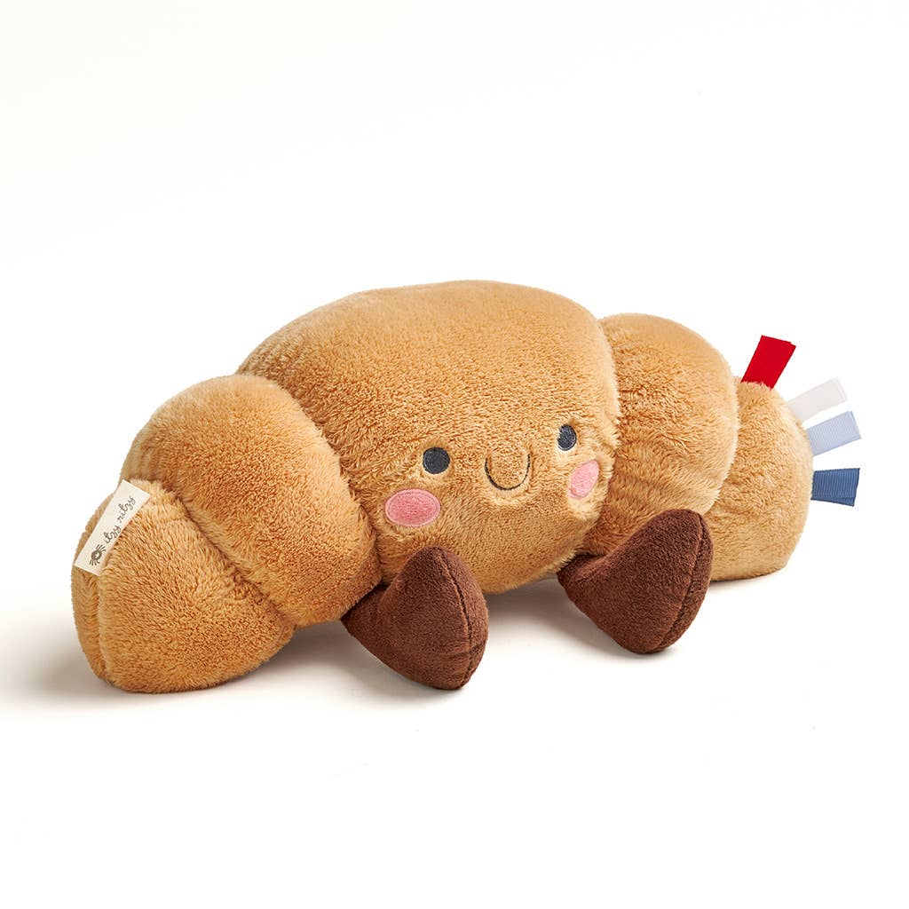 Plush toy resembling a caterpillar on a white background