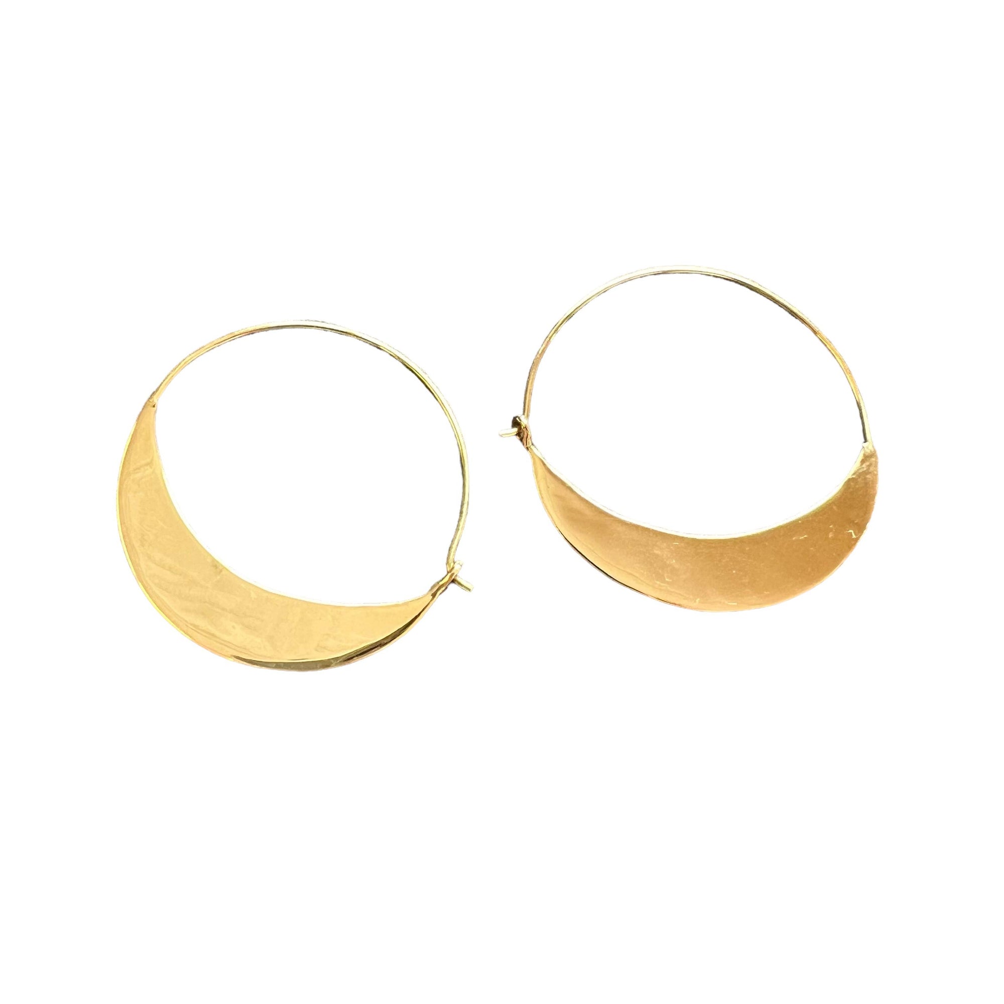 Gold hoop earrings on a white background