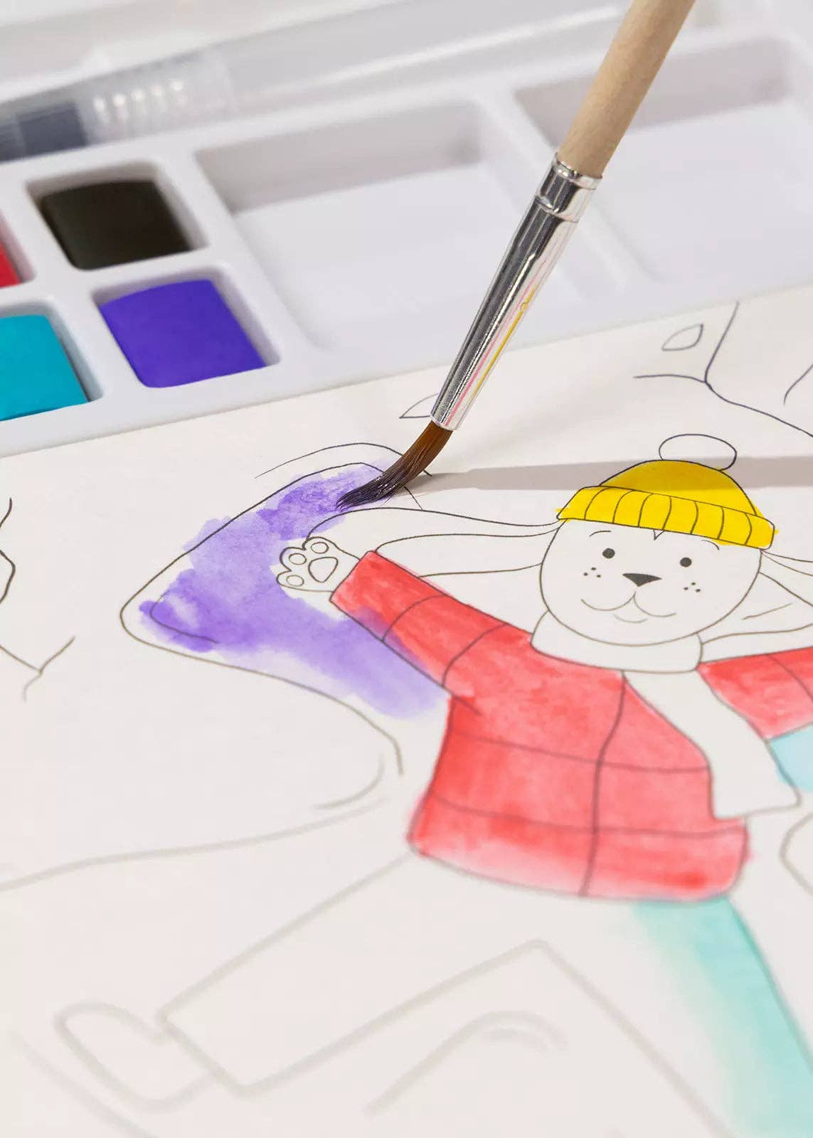 Coloring book with a bear drawing and watercolor paints