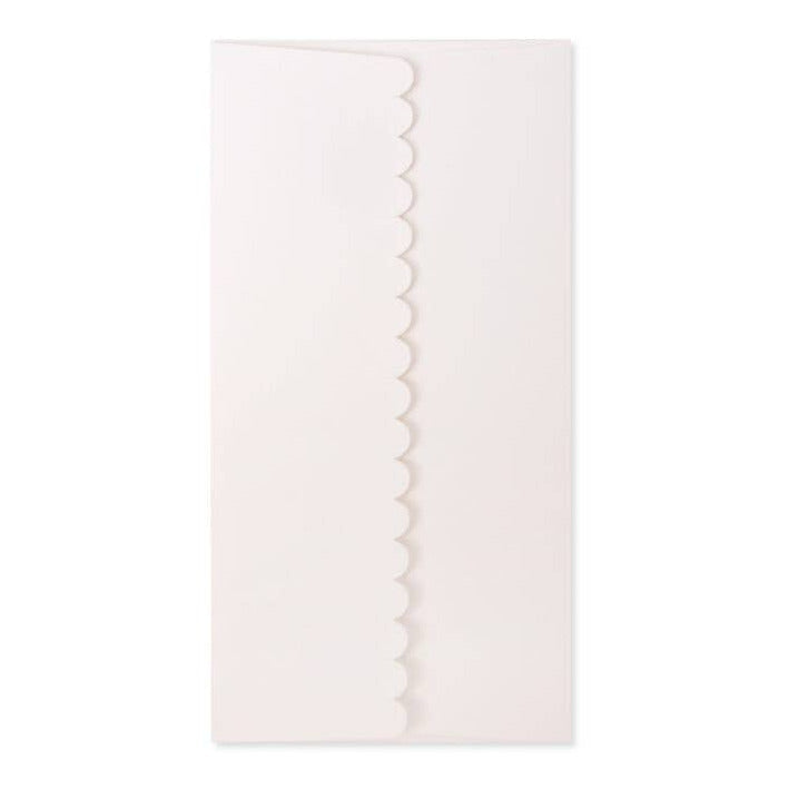 White scalloped edge napkin on a white background