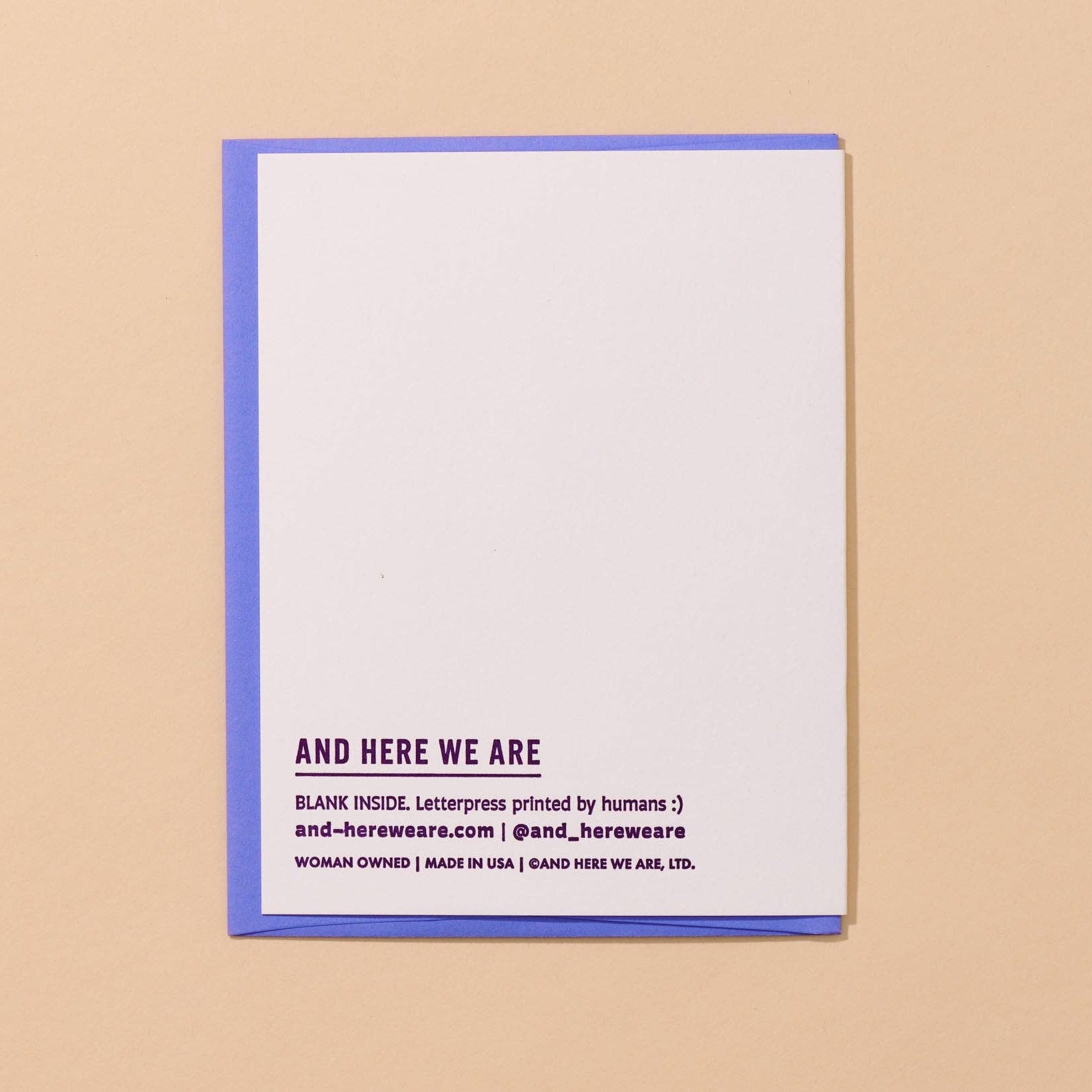 White card with purple text on a beige background