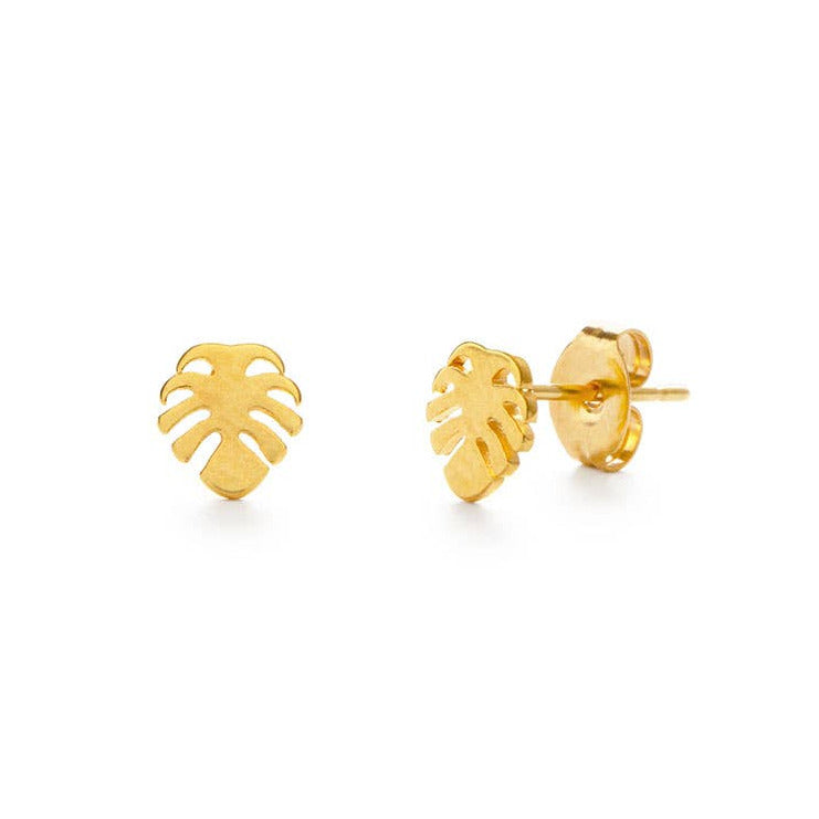 Gold leaf-shaped earrings on a white background