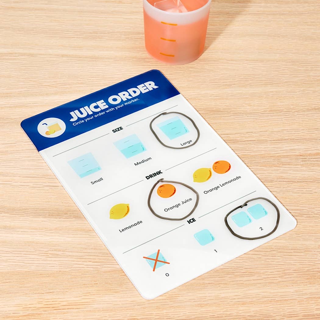 Card with 'Juice Order' instructions on a wooden surface