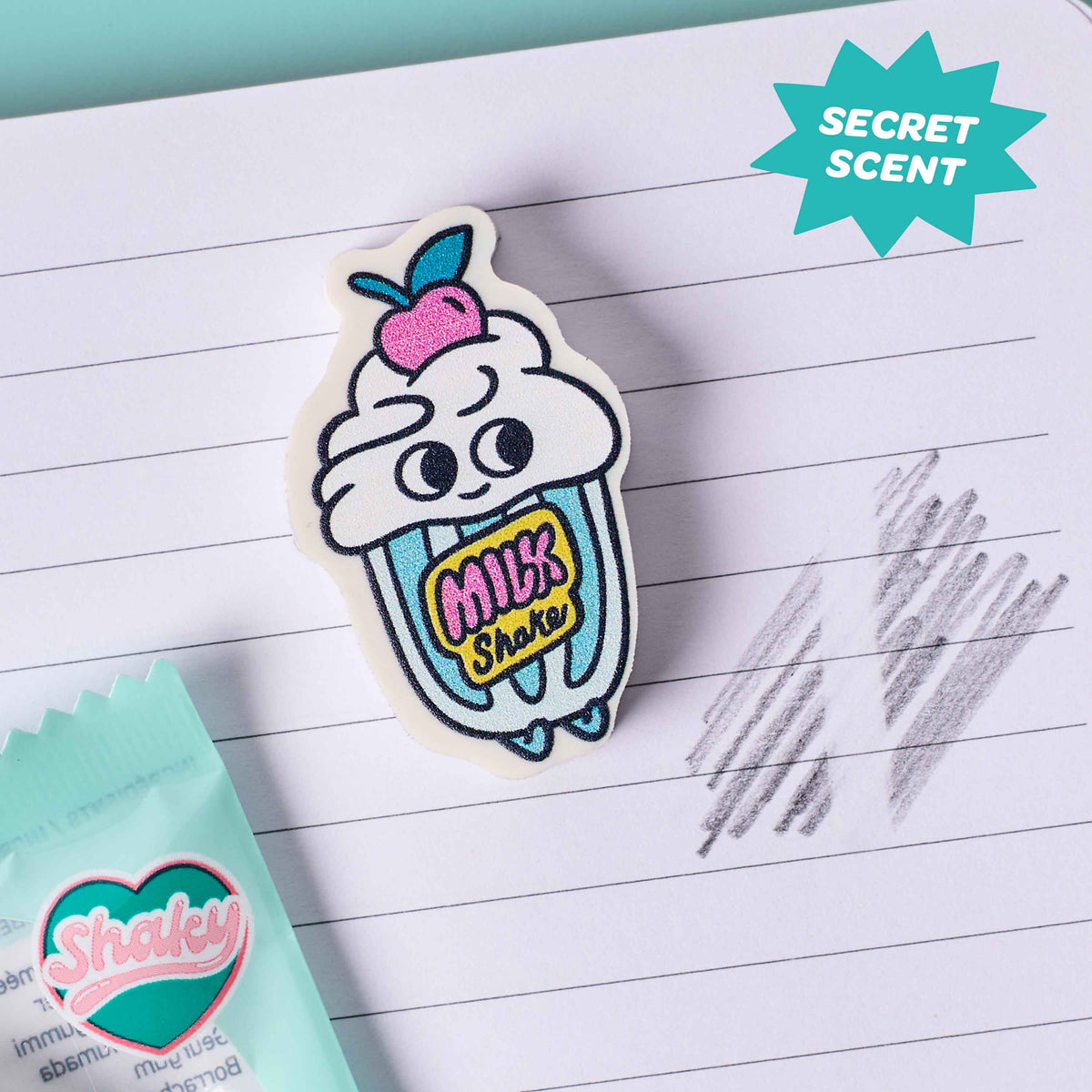 Cartoon milkshake character sticker with 'Secret Scent' label on lined paper