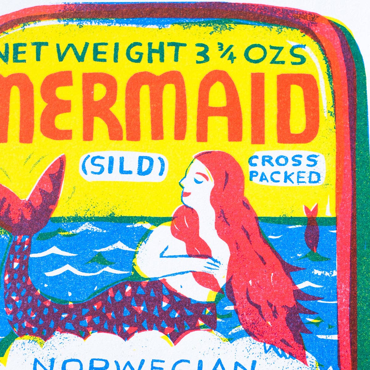 Mermaid label with colorful design and text on a yellow background