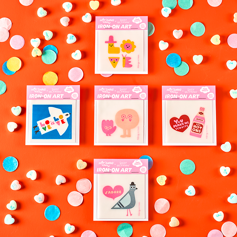Set of colorful 'Pop-On-Art' cards on an orange background with confetti