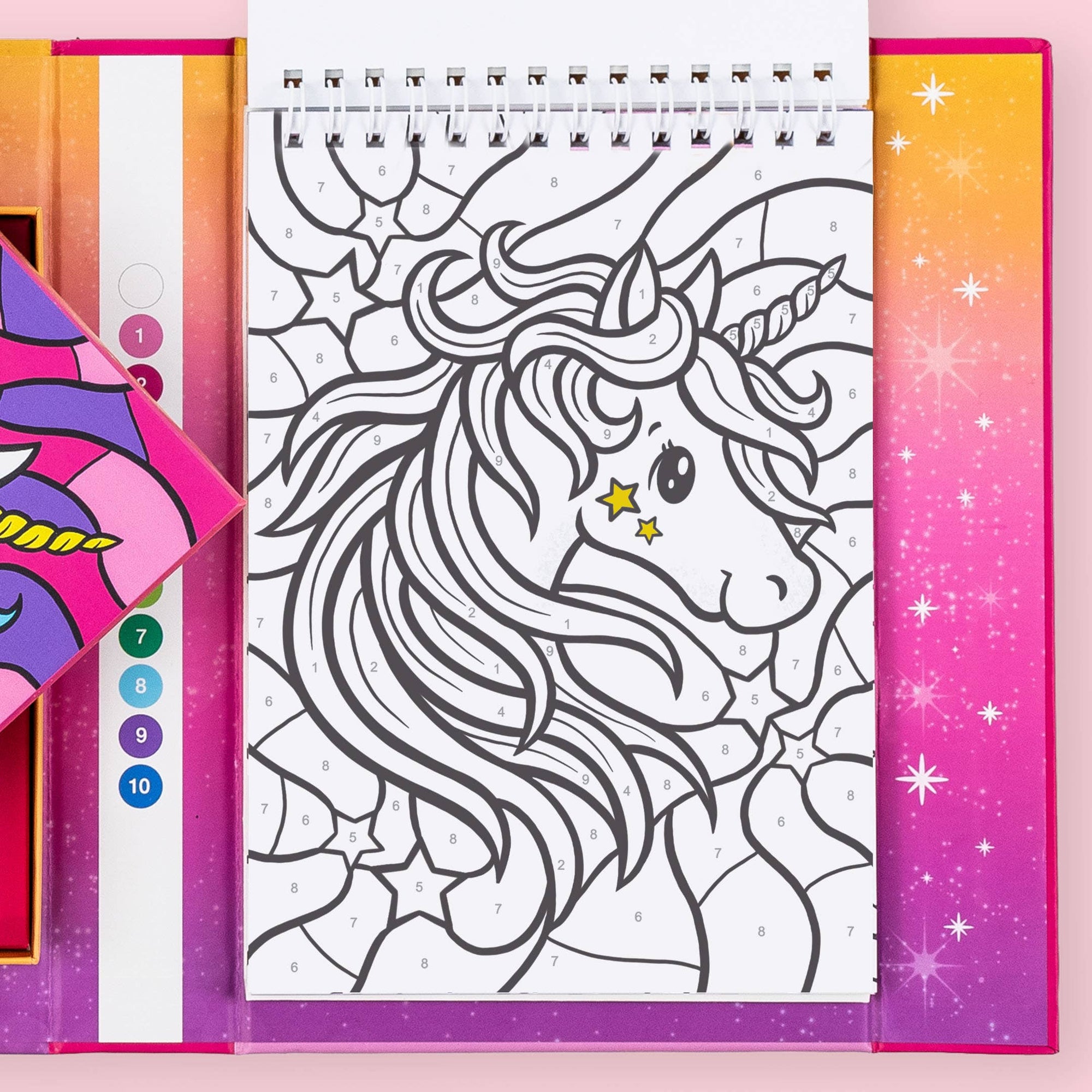 Coloring book with a unicorn design on a pink and purple gradient background