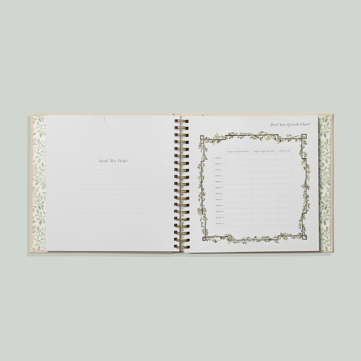 Open notebook with decorative pages on a light gray background