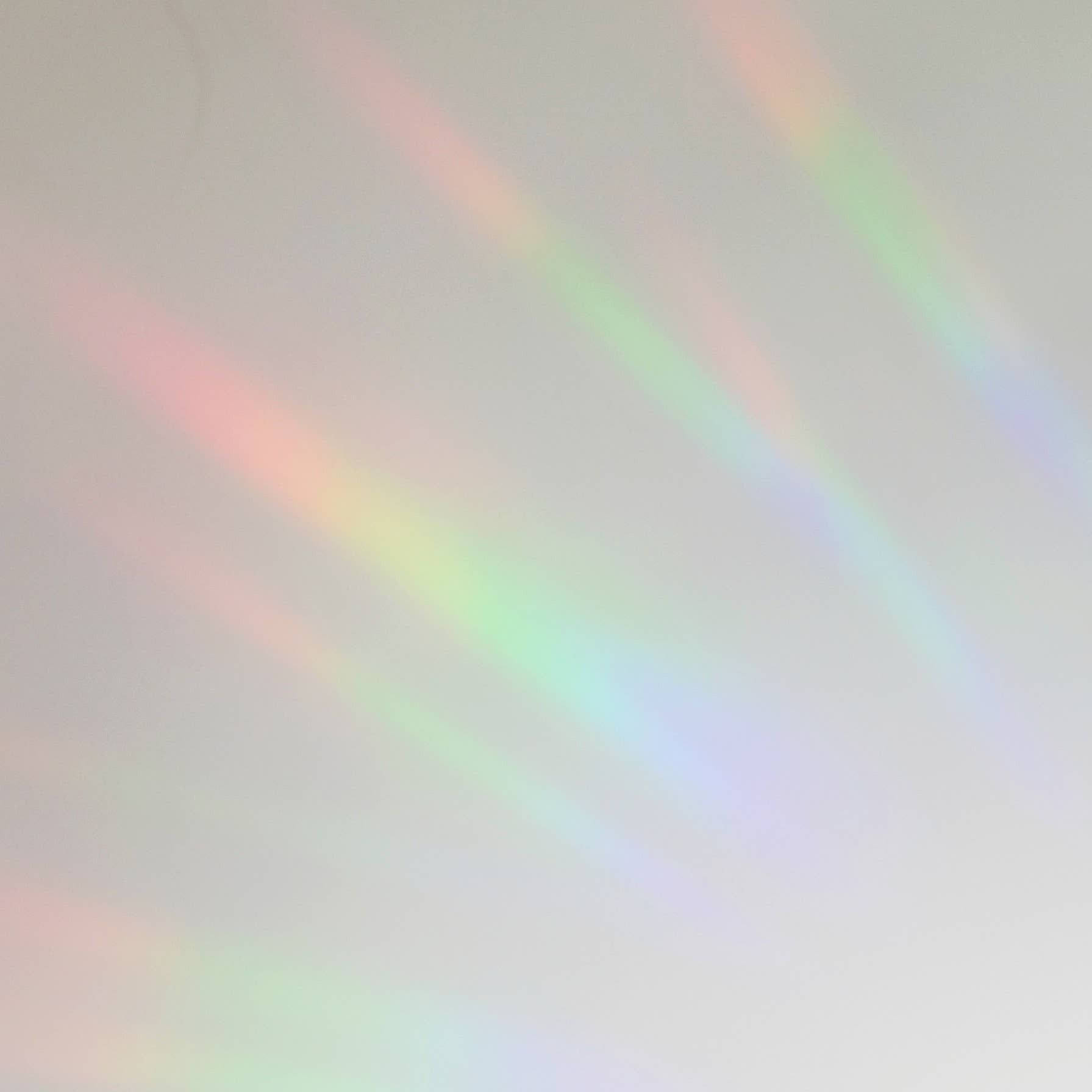Gradient background with rainbow colors on a light gray background