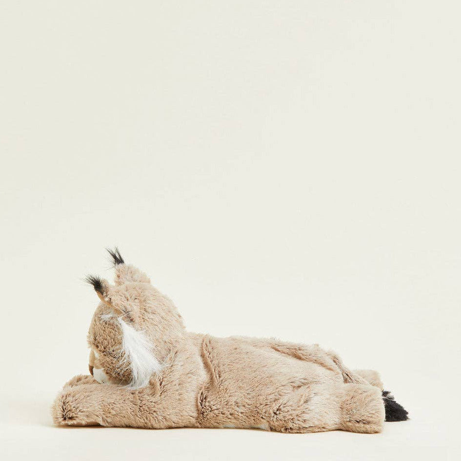 Plush toy fox lying on a white background