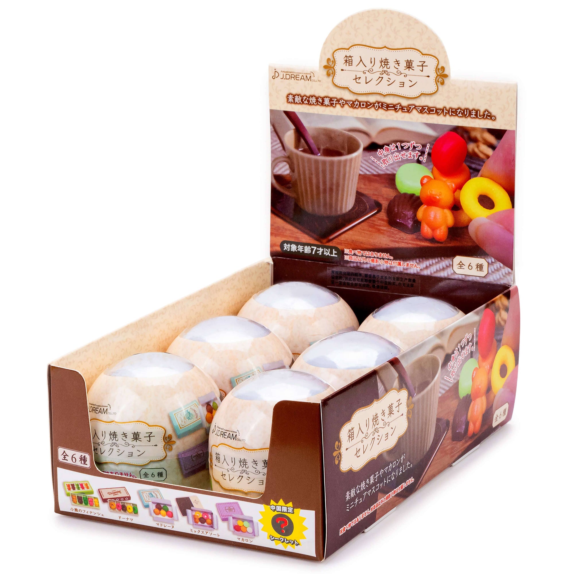 Display box of cream puffs with a small table scene illustration on the packaging.