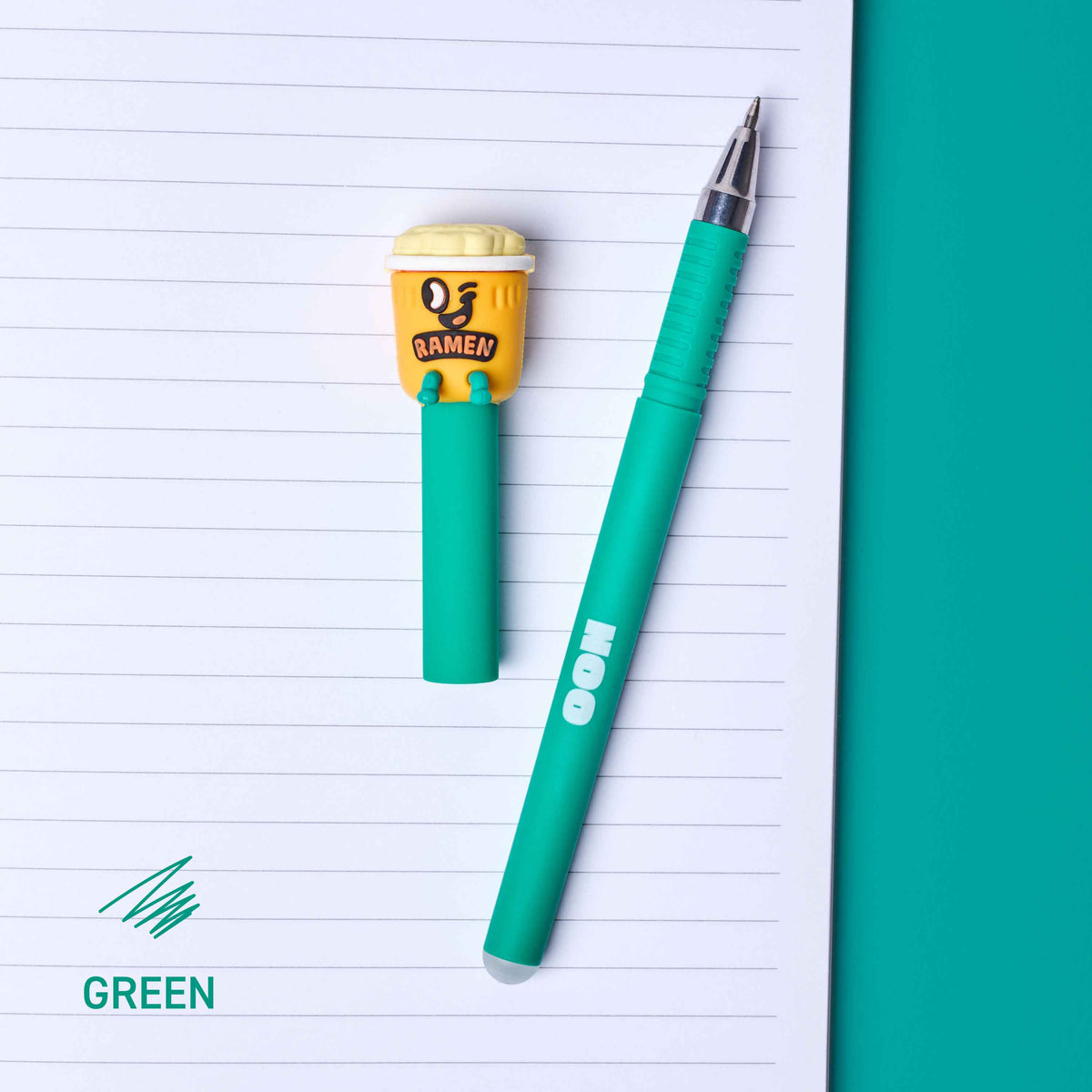 Green pen with a yellow eraser on lined paper
