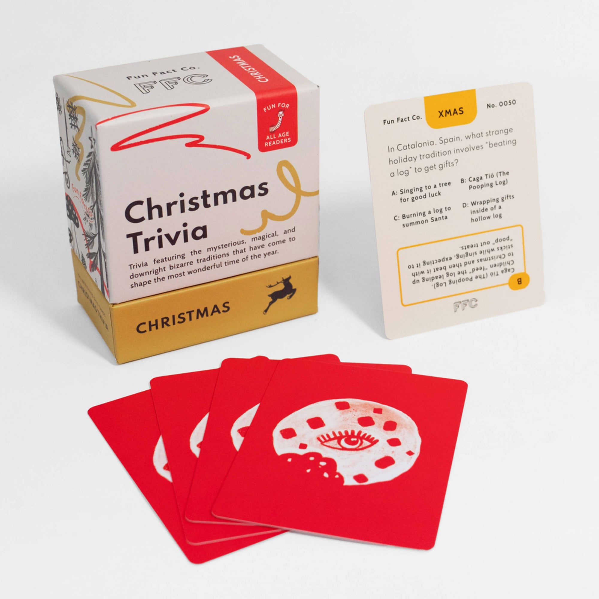 Christmas trivia card game with packaging and cards on a white background