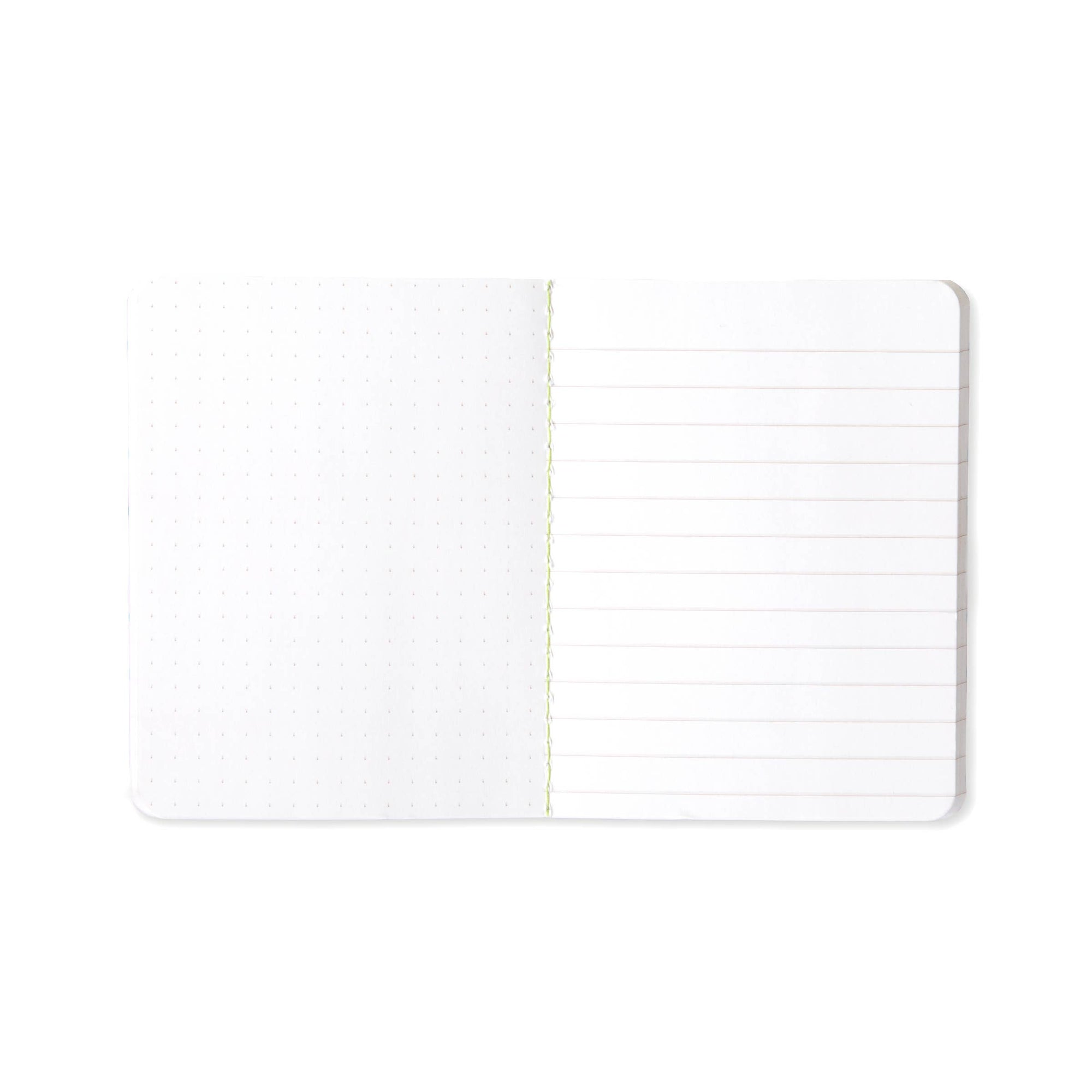 An open white notebook with a dotted grid pattern on the left page and lined horizontal writing on the right page, shown on a clean white background.