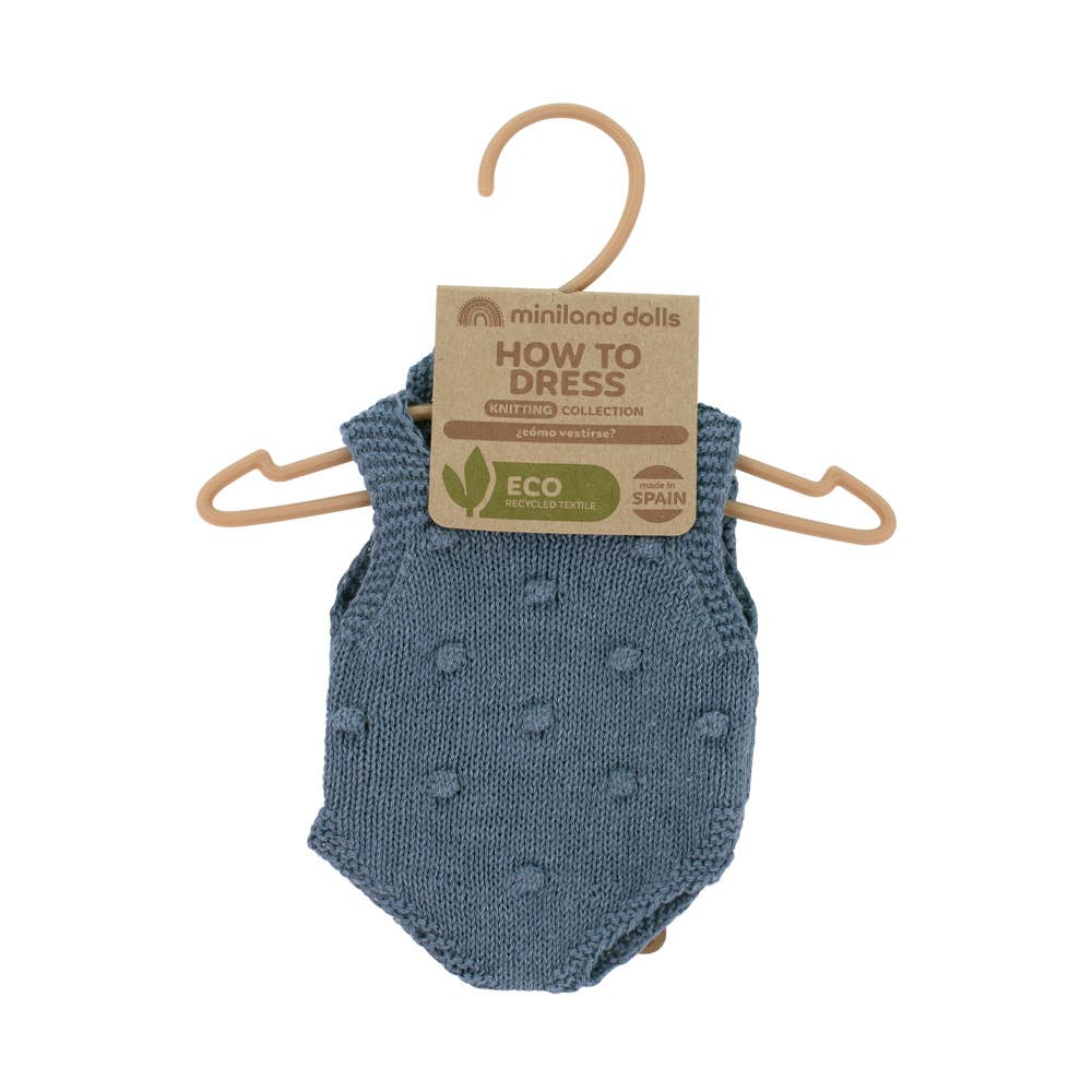 Blue knitted baby romper on a hanger with 'How to Dress' label