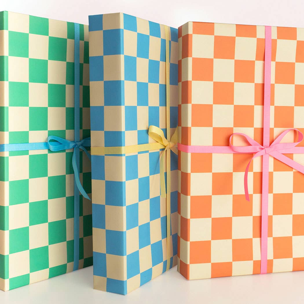 Three checkered gift boxes with ribbons on a white background
