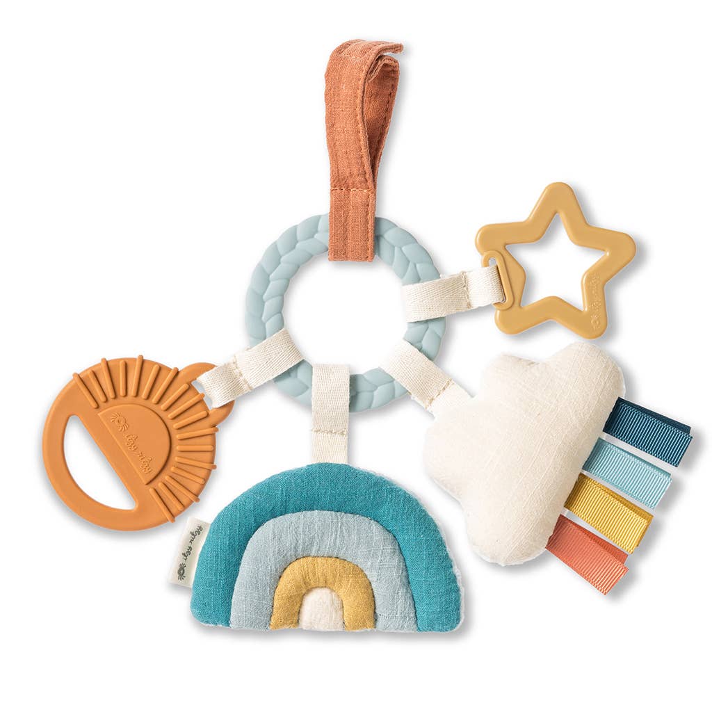 Colorful baby toy with various shapes and textures on a white background