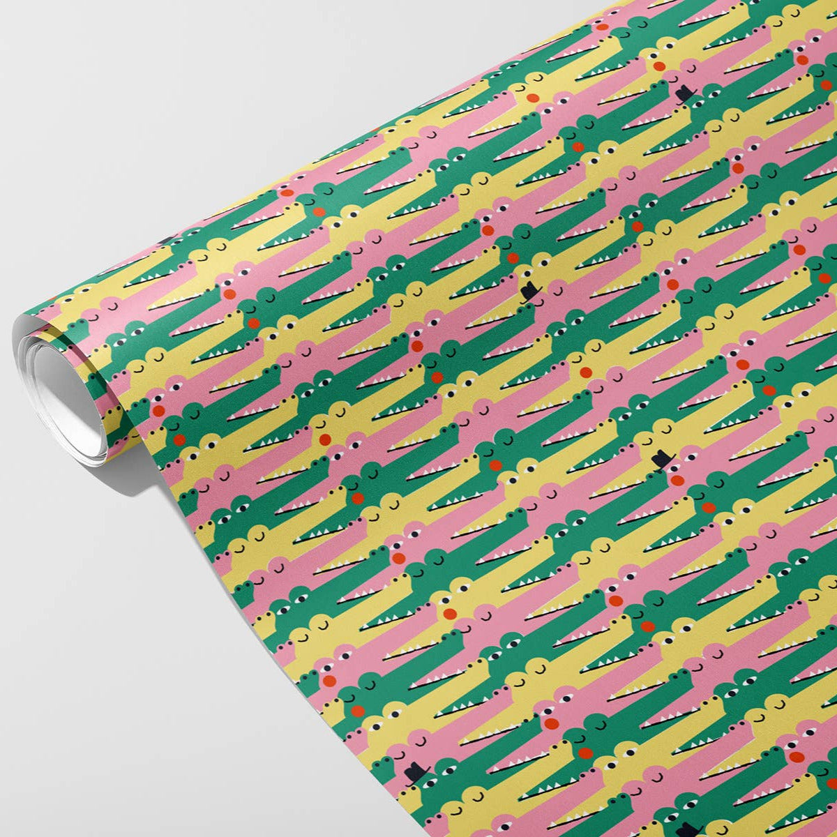 Roll of colorful patterned alligators with pink, green, and yellow design on a white background