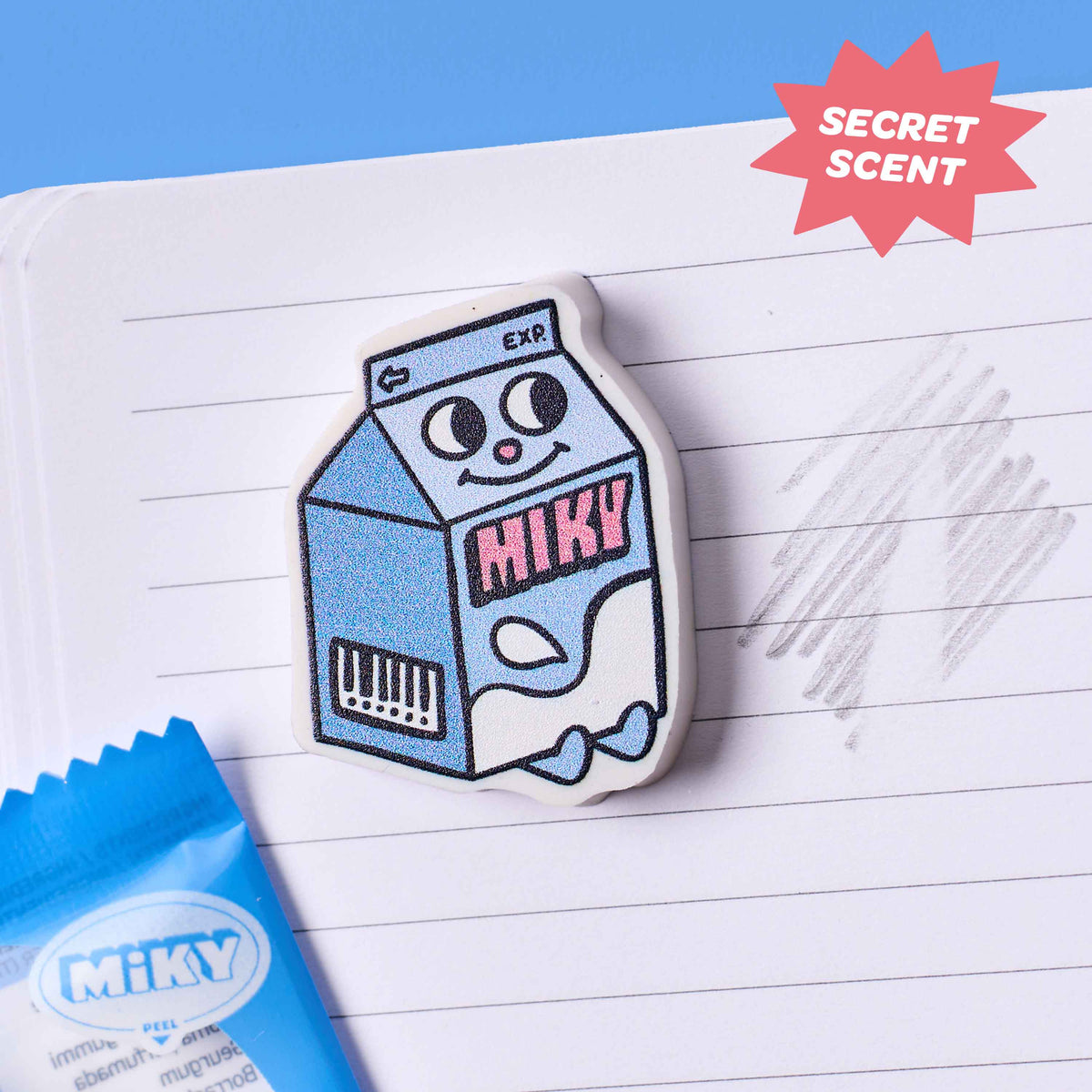 Mikv milk carton-shaped product with a blue packaging on lined paper