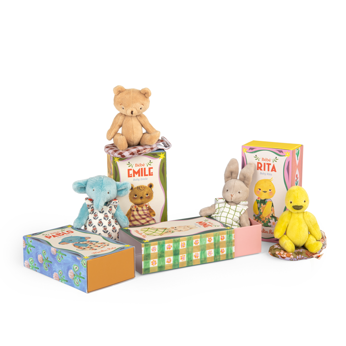 Collection of small stuffed animals in colorful boxes on a white background