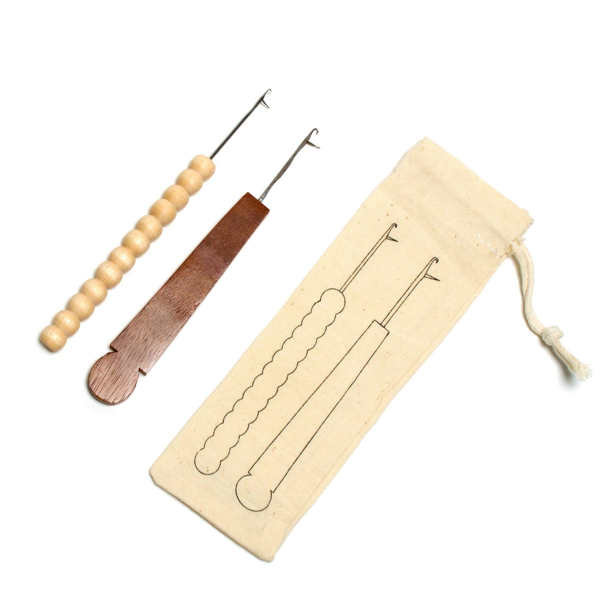 Set of three tools with wooden and metal handles on a white background