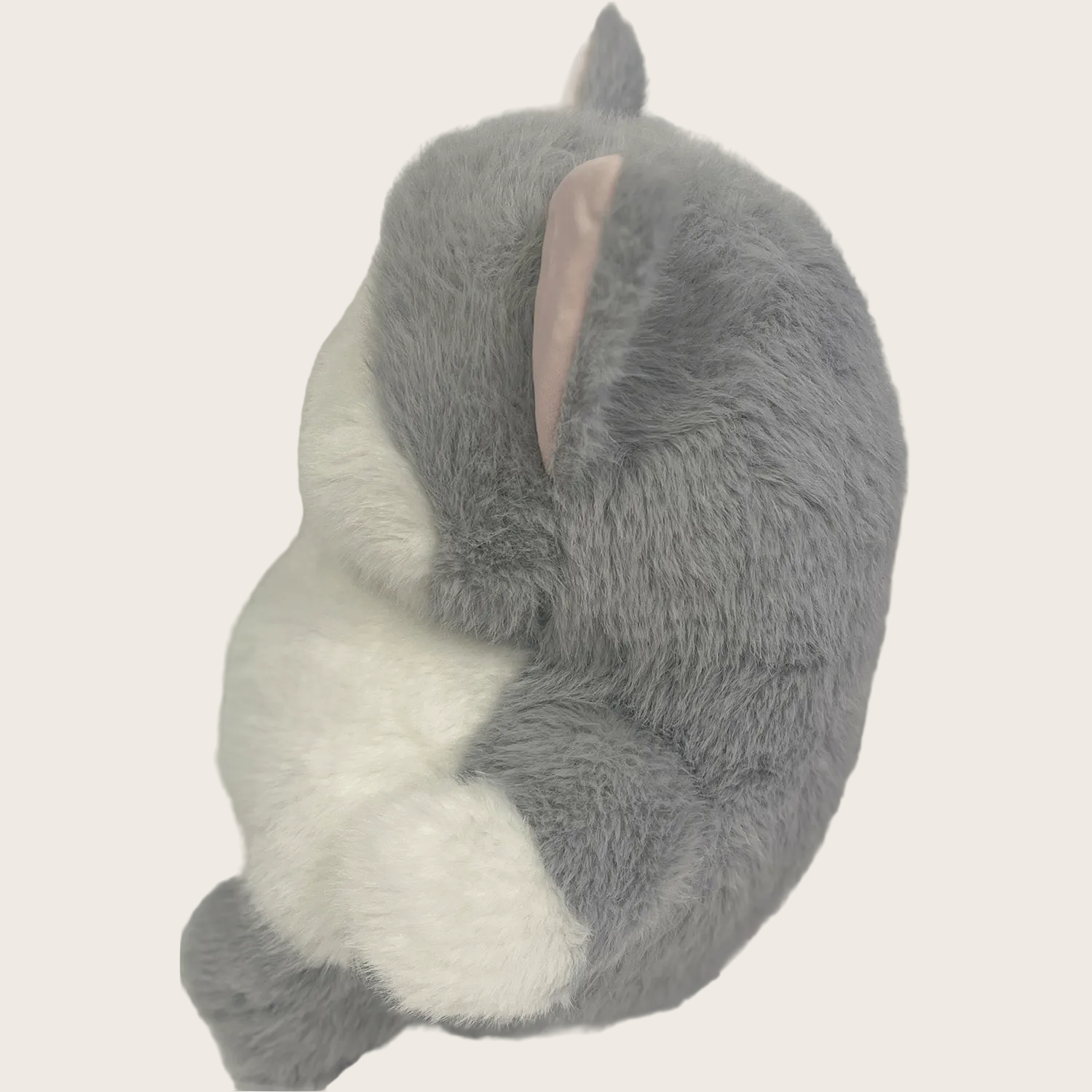 Gray plush toy resembling a cat on a white background