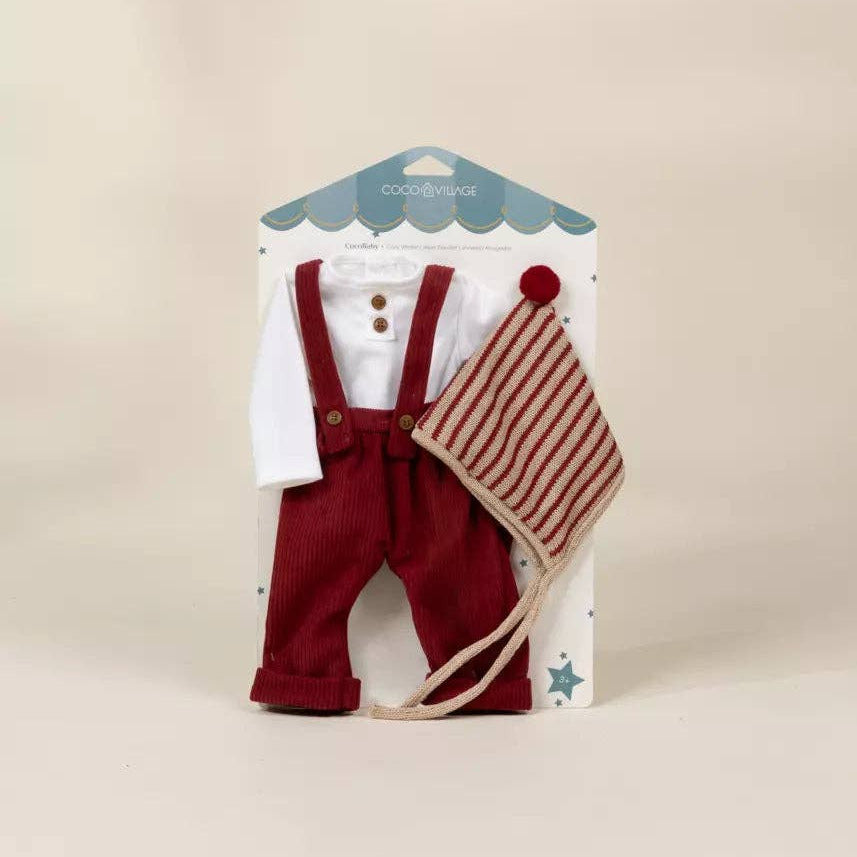 Children's outfit with red overalls, white shirt, and striped hat on a beige background