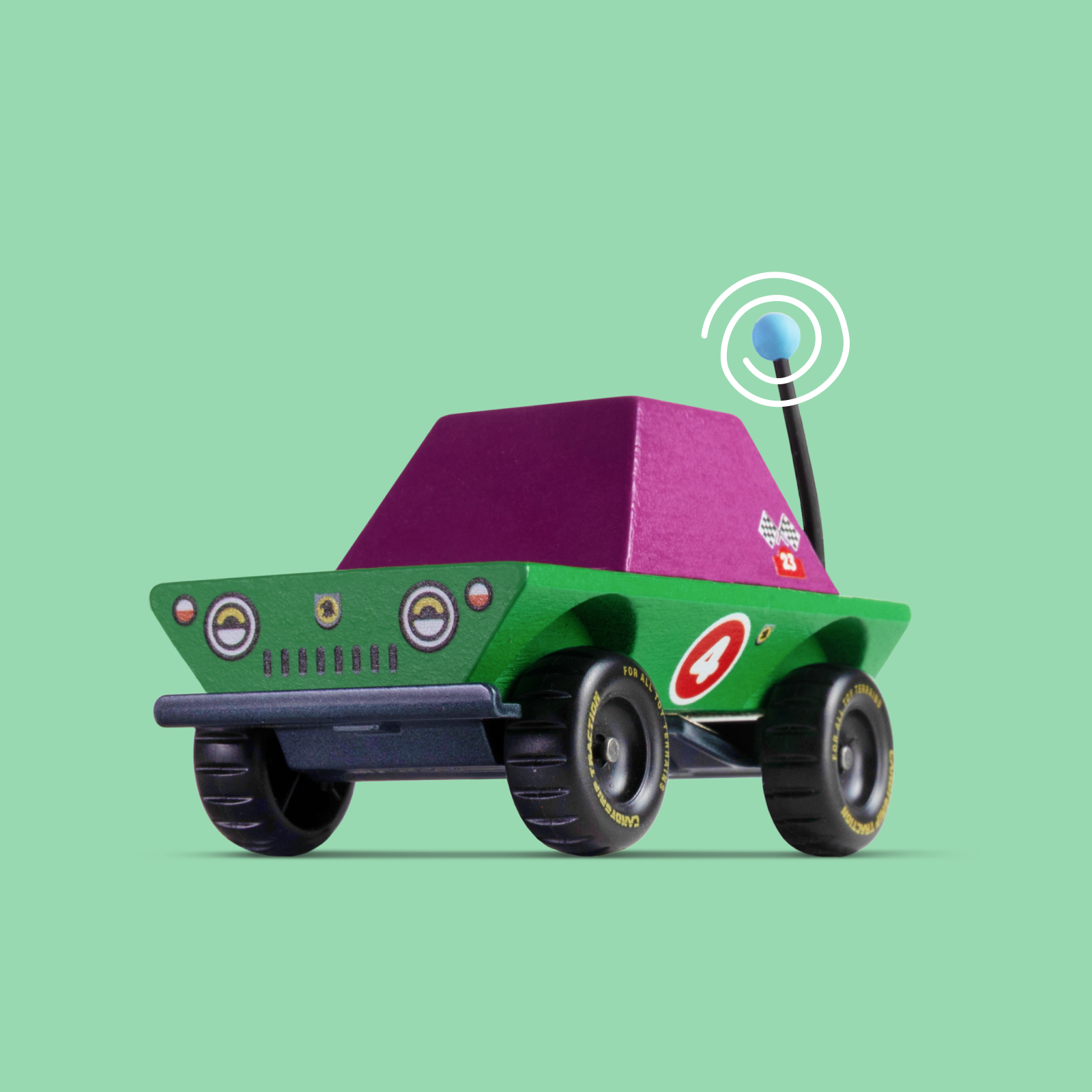 Toy car with a purple roof and antenna on a green background