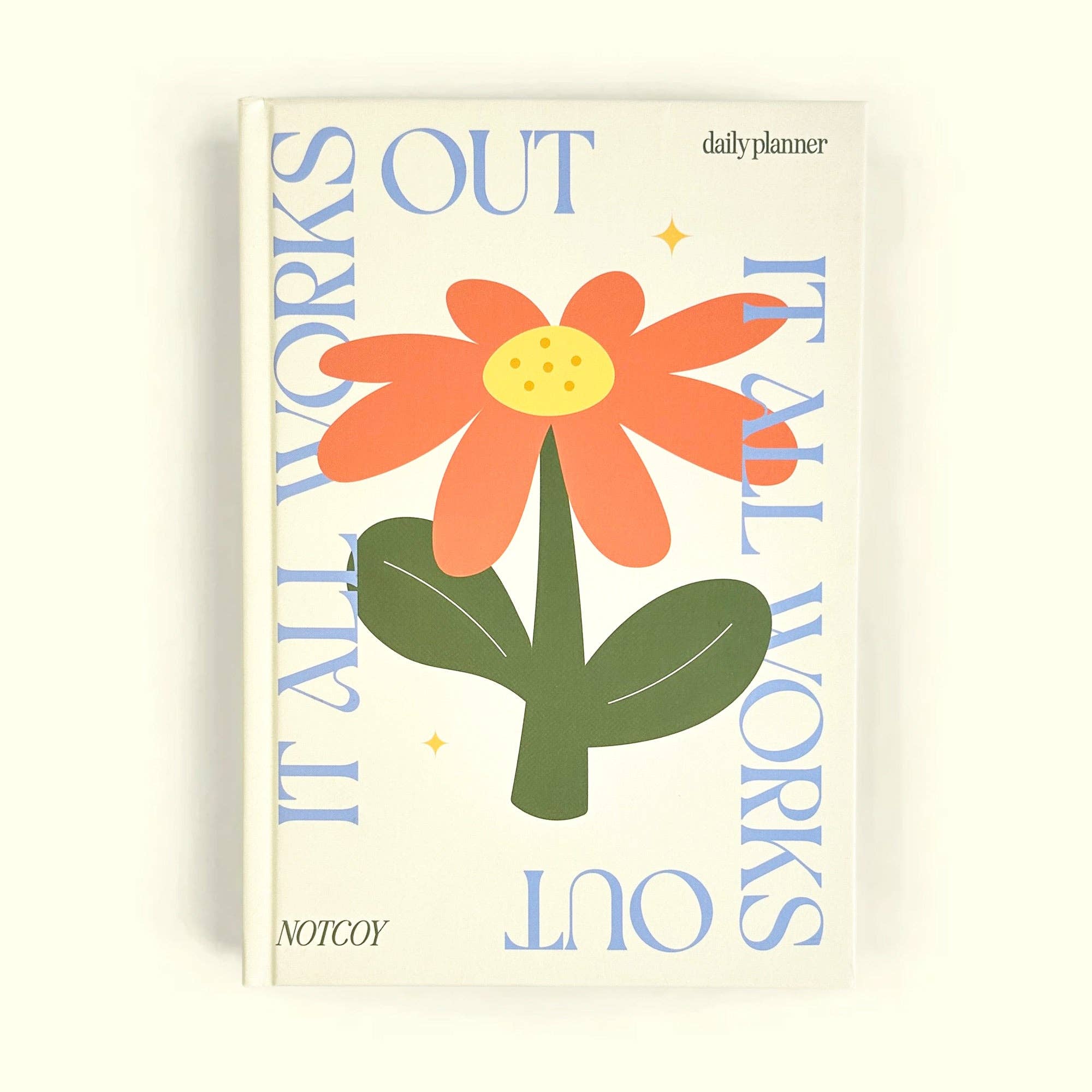 Planner with a colorful flower design and text on a white background