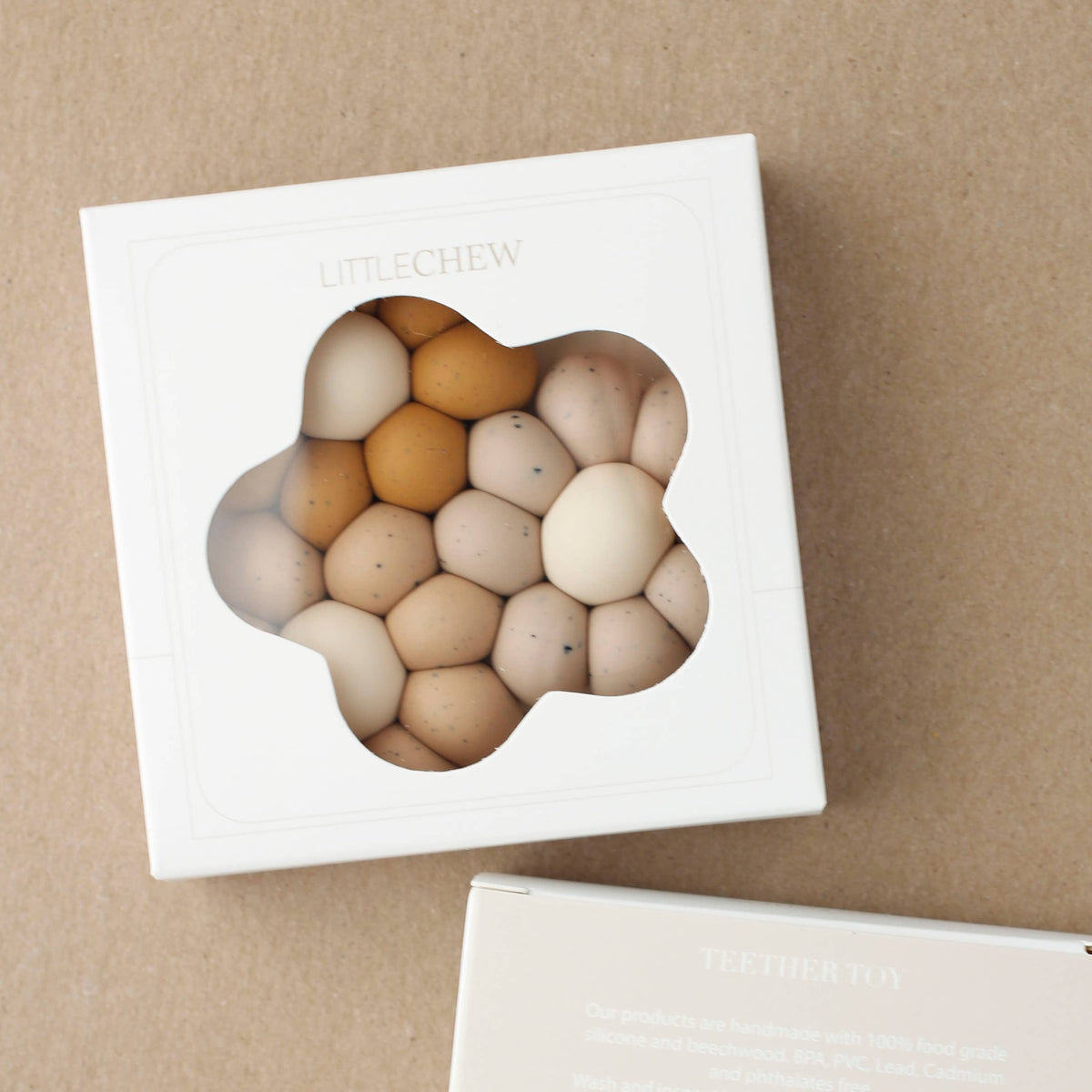 Set of wooden eggs in a box on a brown background