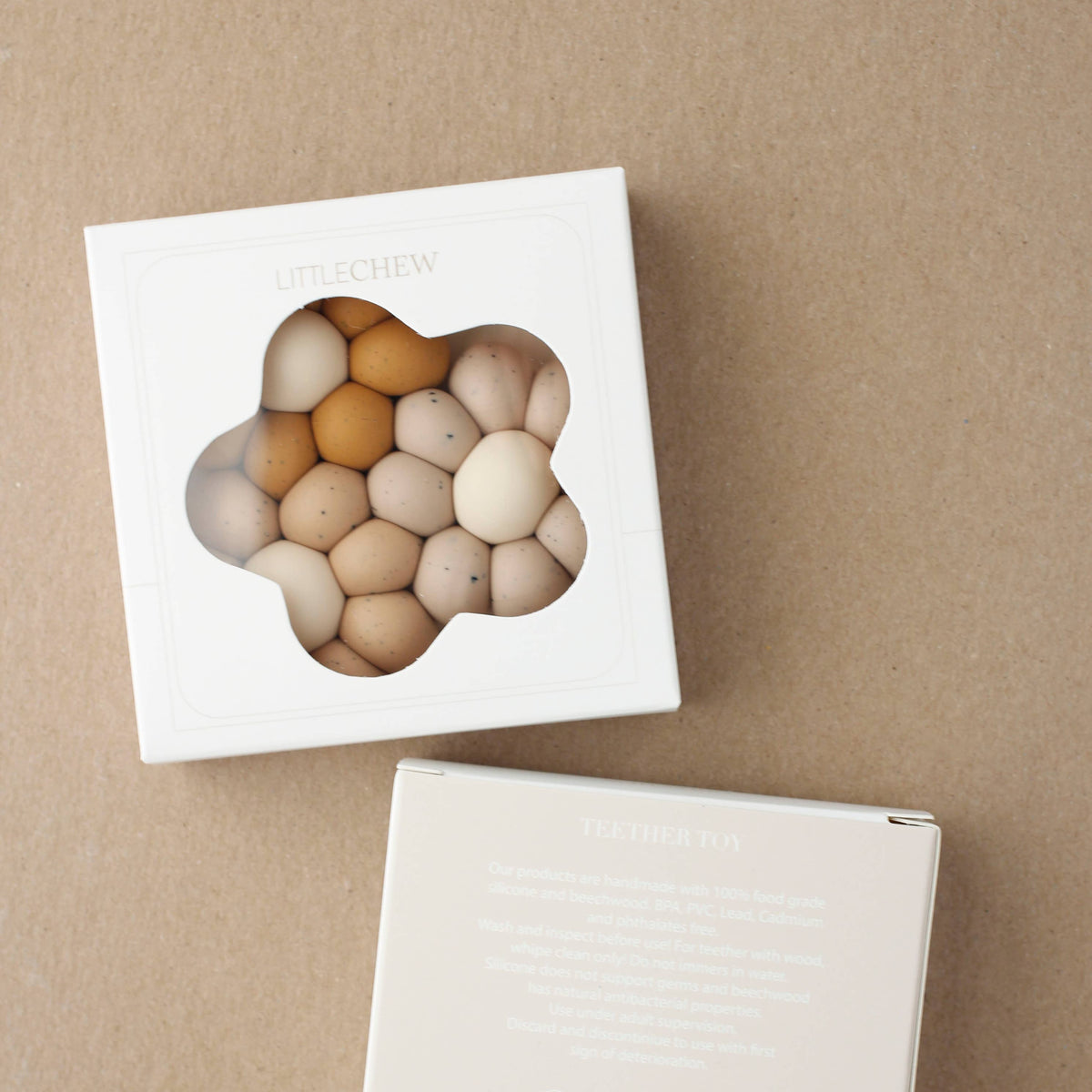 Set of wooden eggs in a box on a brown background