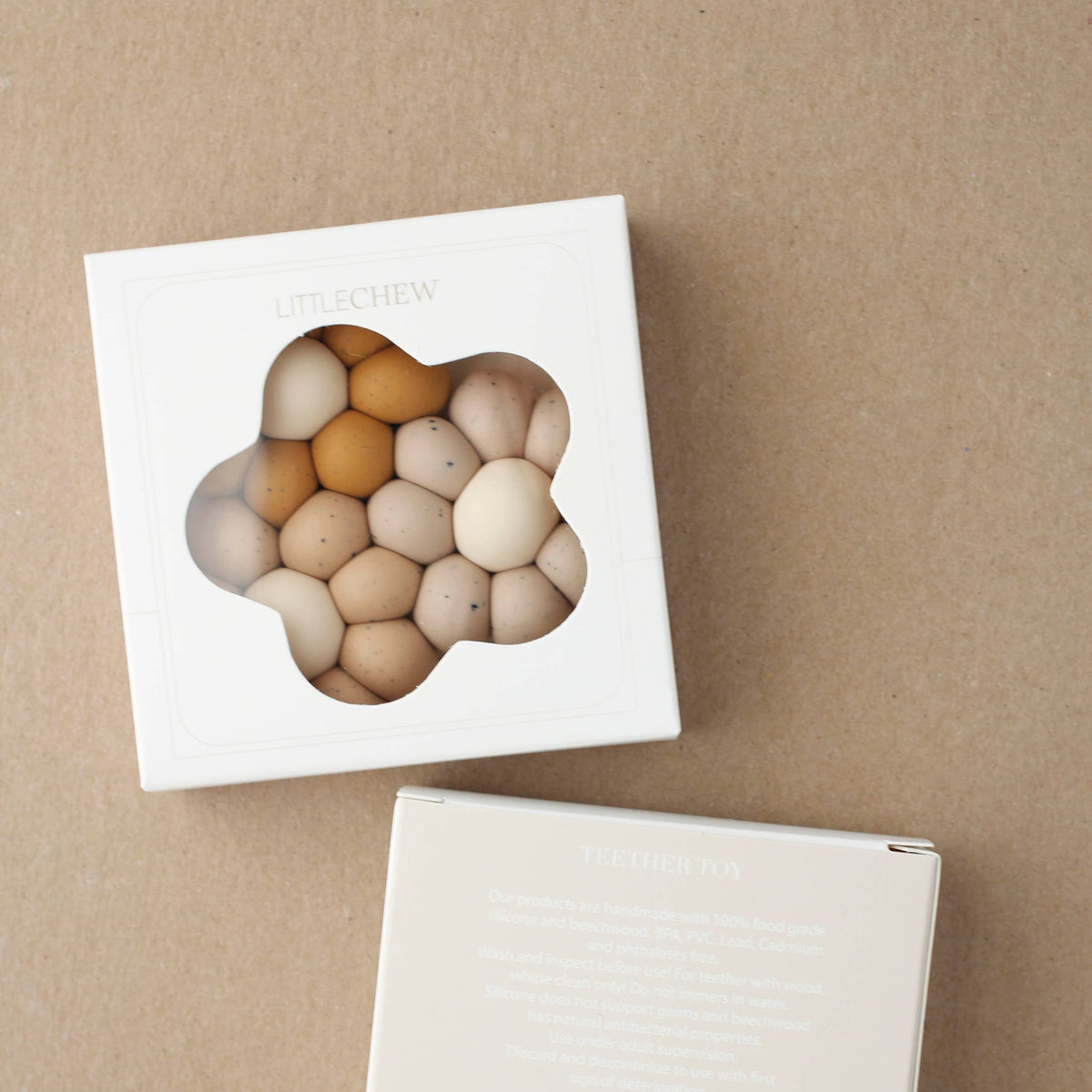 Set of wooden eggs in a box on a brown background