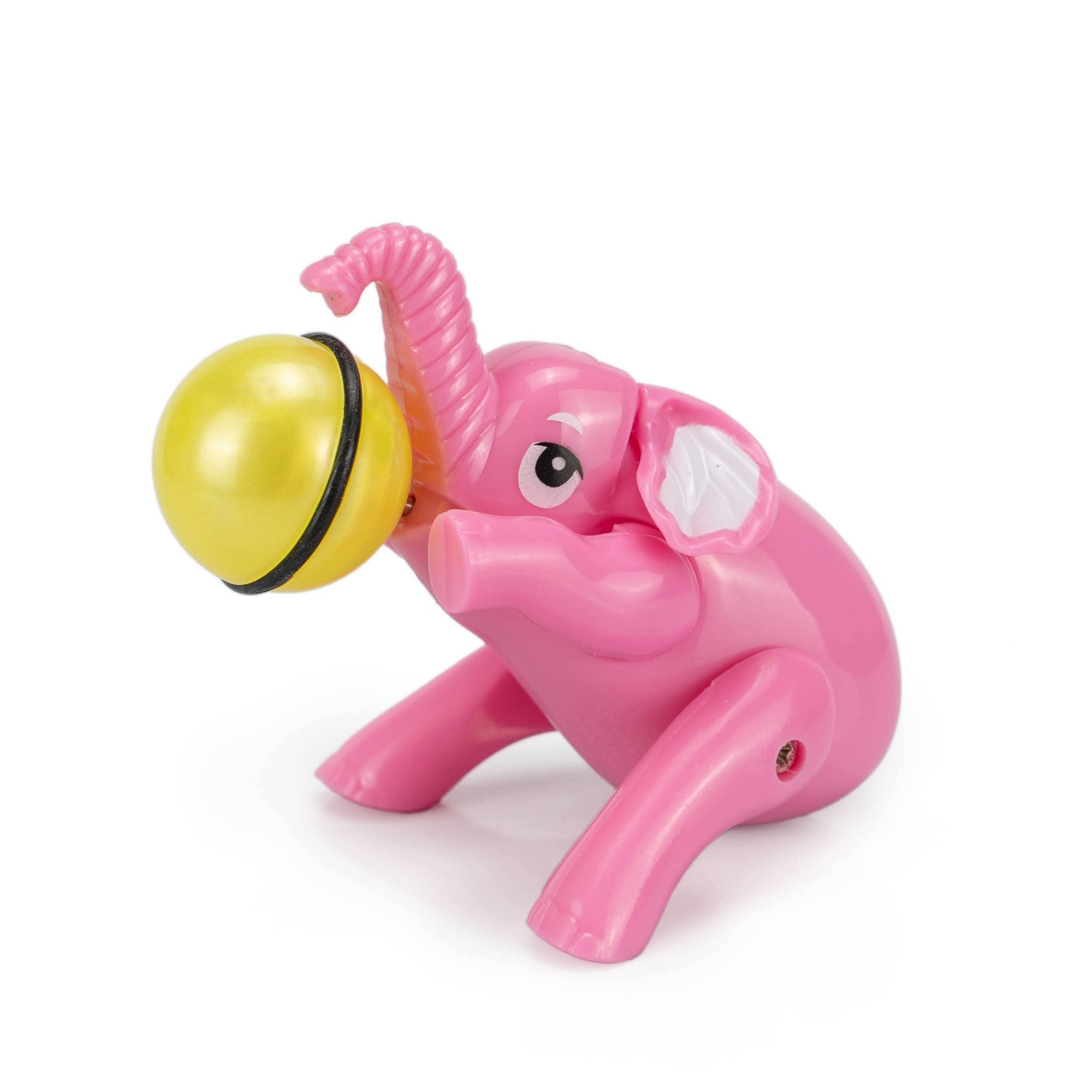 Pink elephant toy with a yellow ball on a white background