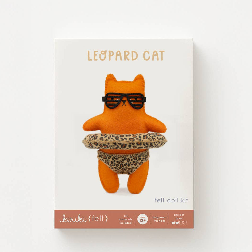 Leopard cat felt doll kit with sunglasses and leopard print skirt on a white background