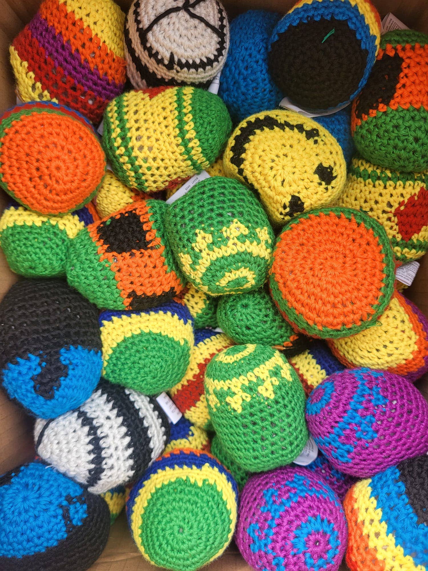 Colorful crocheted toys with various patterns and designs.
