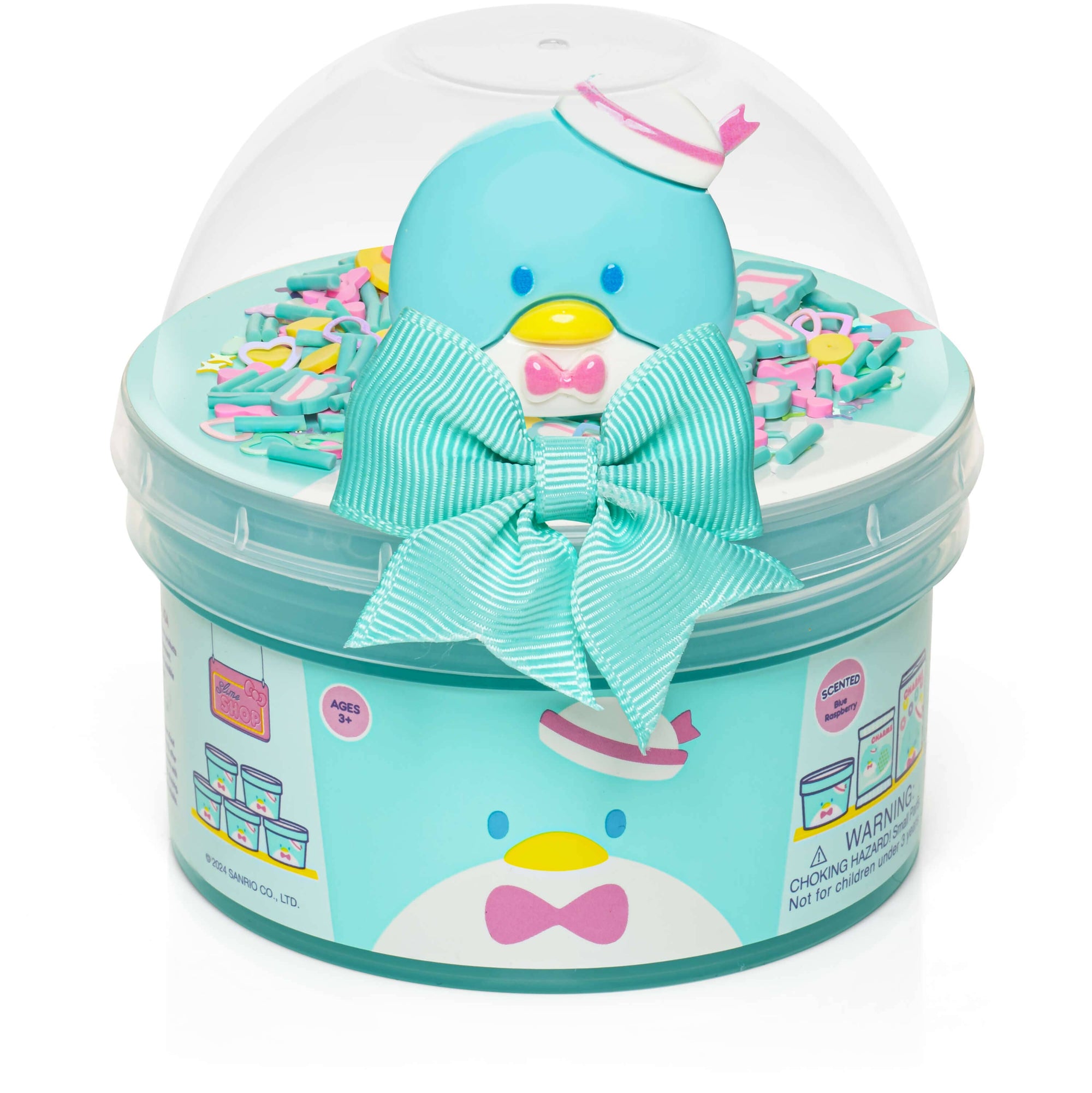 Toy penguin in a clear ball with colorful confetti inside, tied with a bow, on a white background.