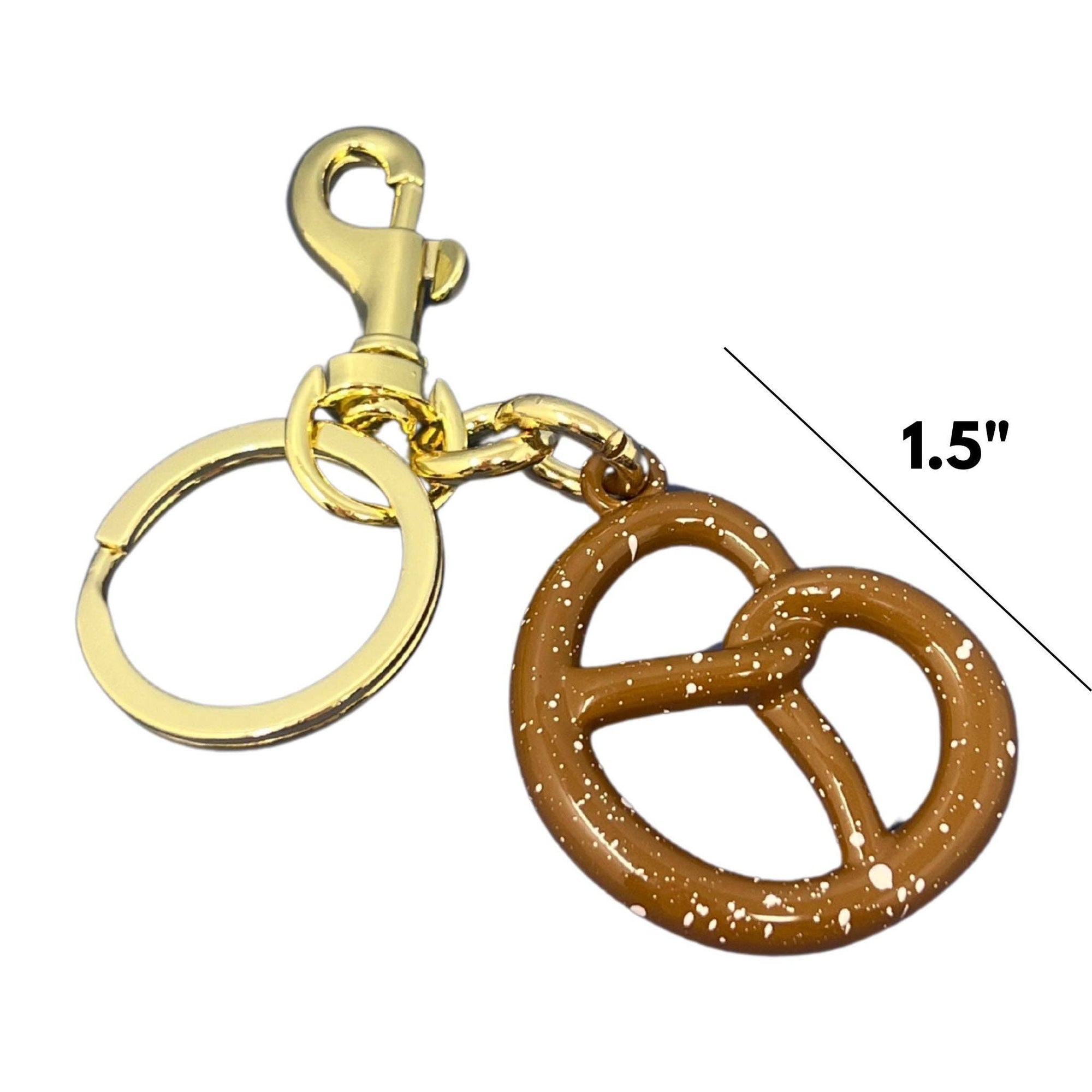 Brown pretzel-shaped keychain with gold clasp on a white background