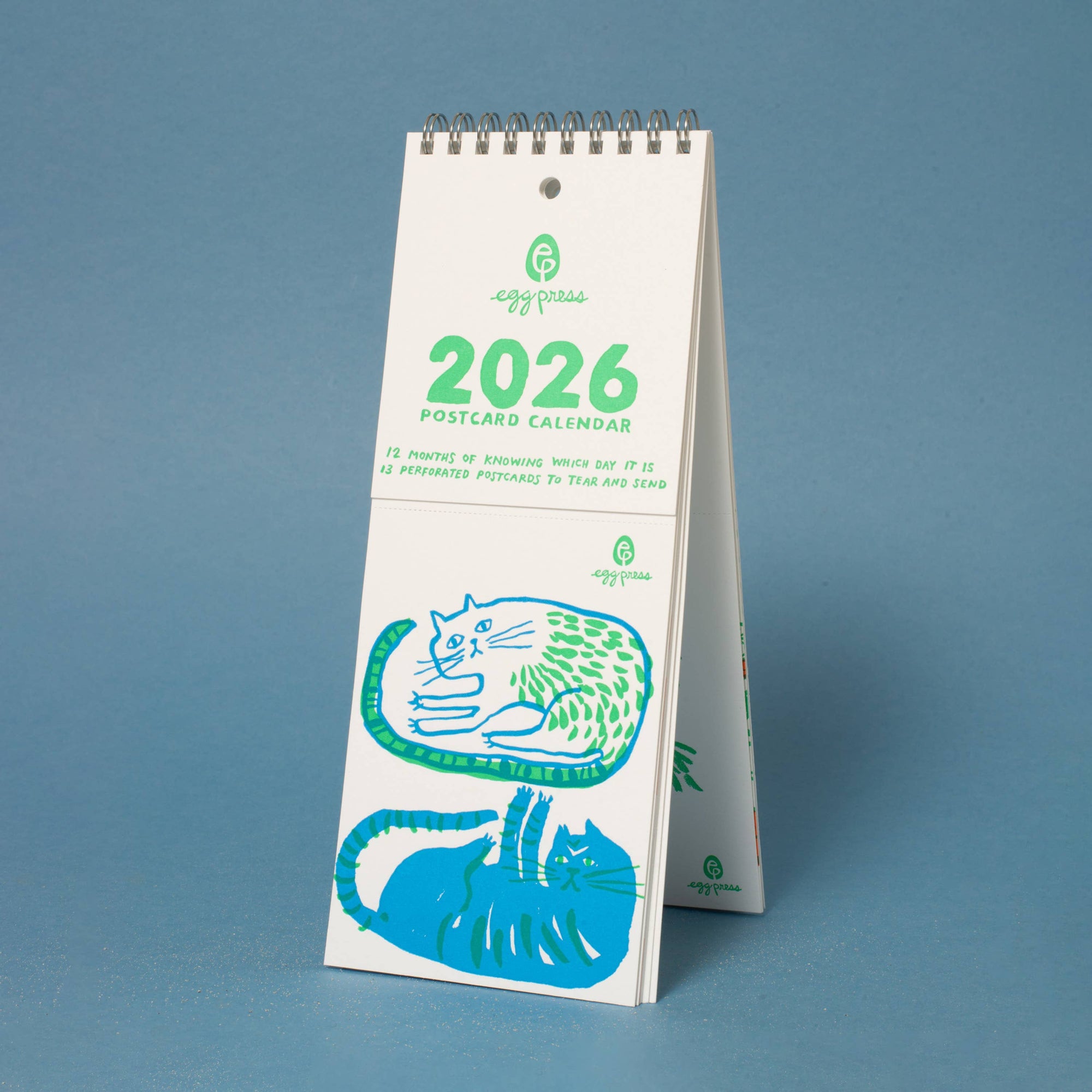 2026 postcard calendar with cat illustrations on a blue background