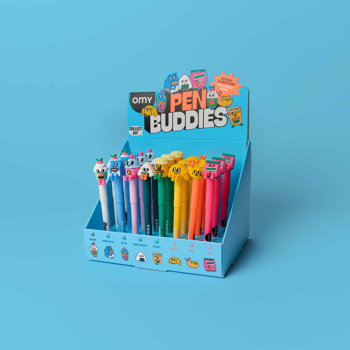 Display of colorful pens with cartoon characters in a blue holder against a blue background