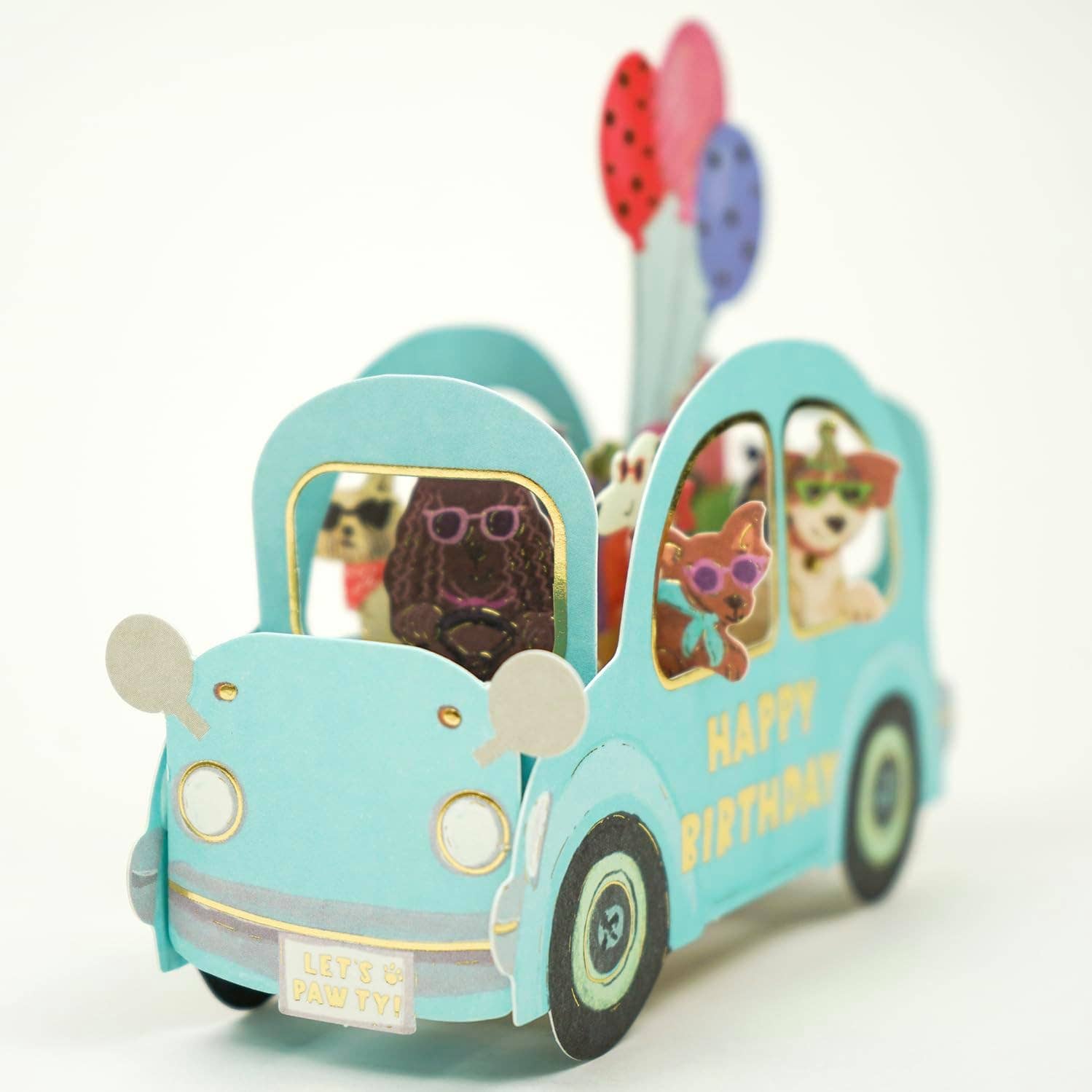 Toy car with small dogs inside, featuring 'Happy Birthday' text on a white background
