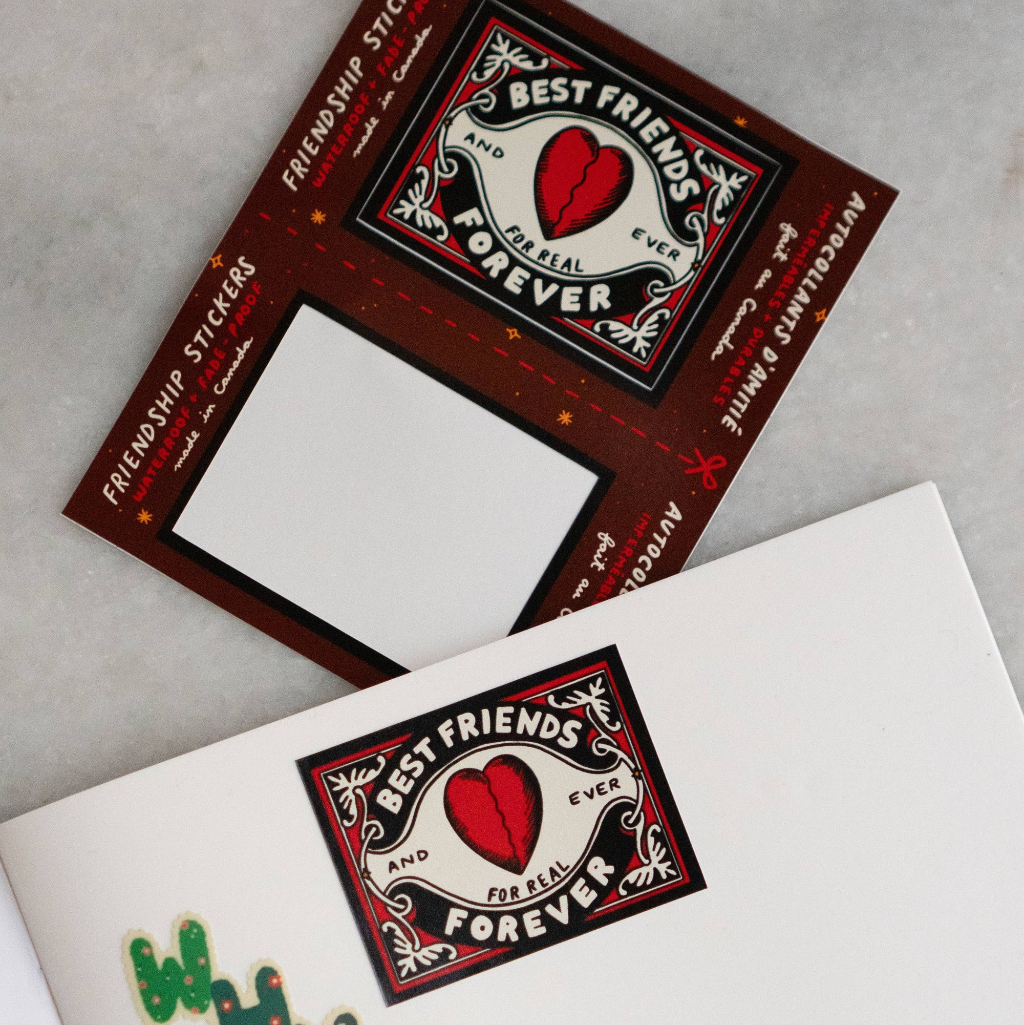 Two friendship stickers with 'Best Friends Forever' design on a gray surface.